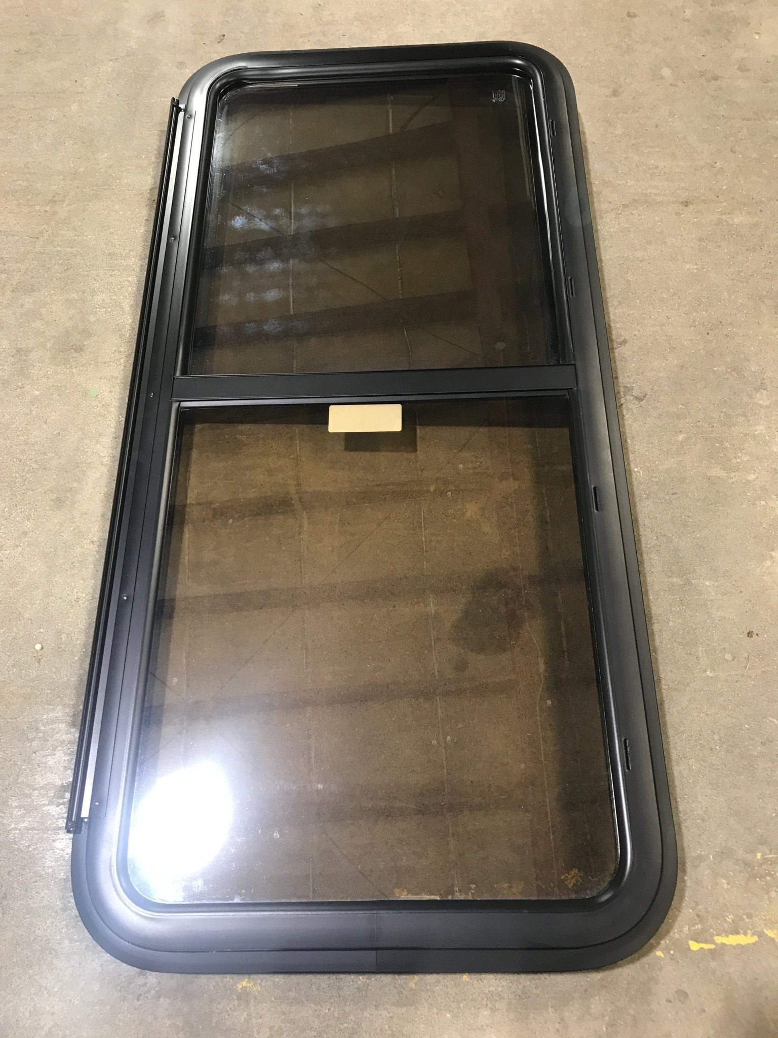 Used Black Radius Opening Window : 47 1/2" W x 21 1/2" H x 1 1/2" D - Young Farts RV Parts