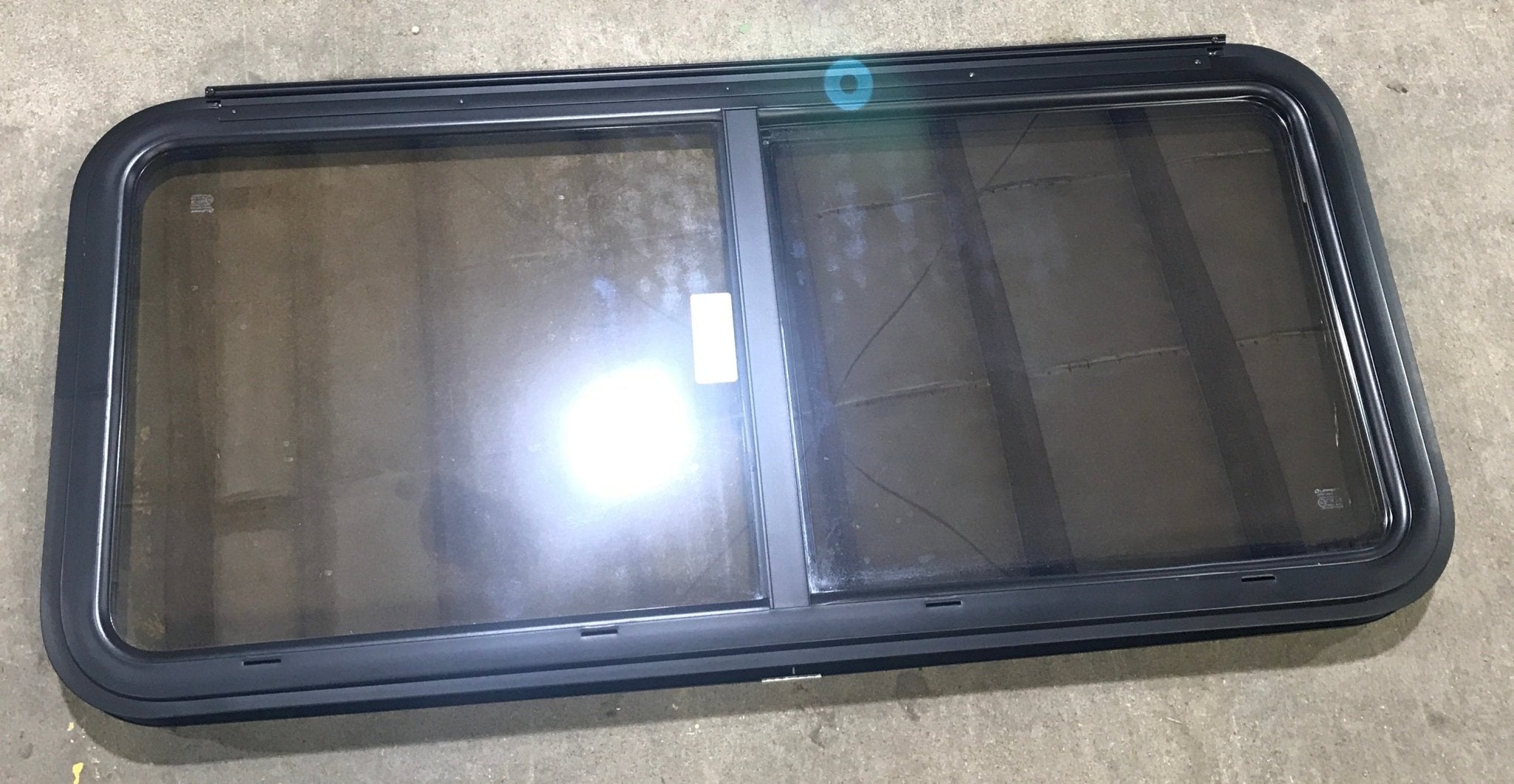 Used Black Radius Opening Window : 47 1/2" W x 21 1/2" H x 1 1/2" D - Young Farts RV Parts