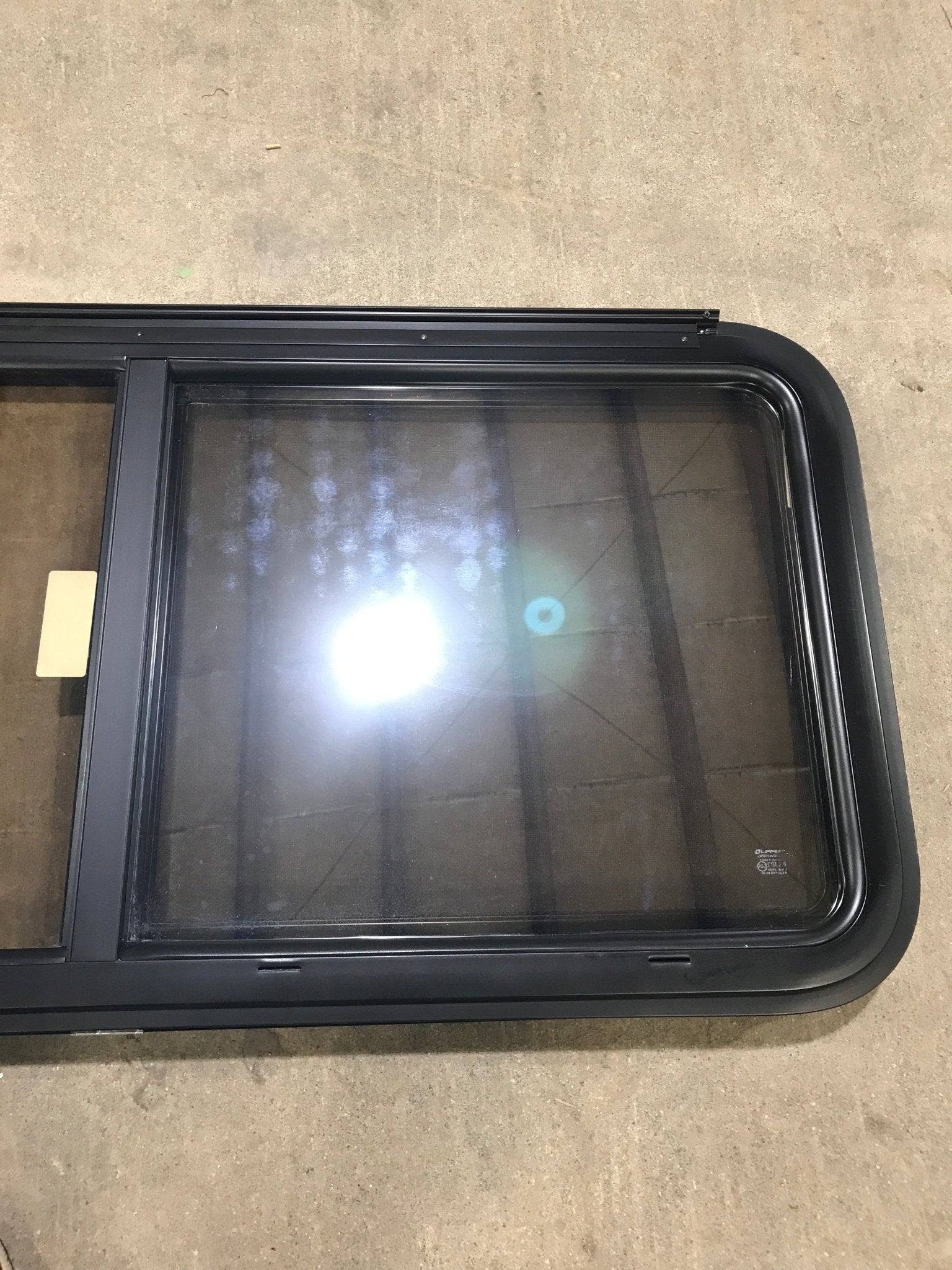Used Black Radius Opening Window : 47 1/2" W x 21 1/2" H x 1 1/2" D - Young Farts RV Parts