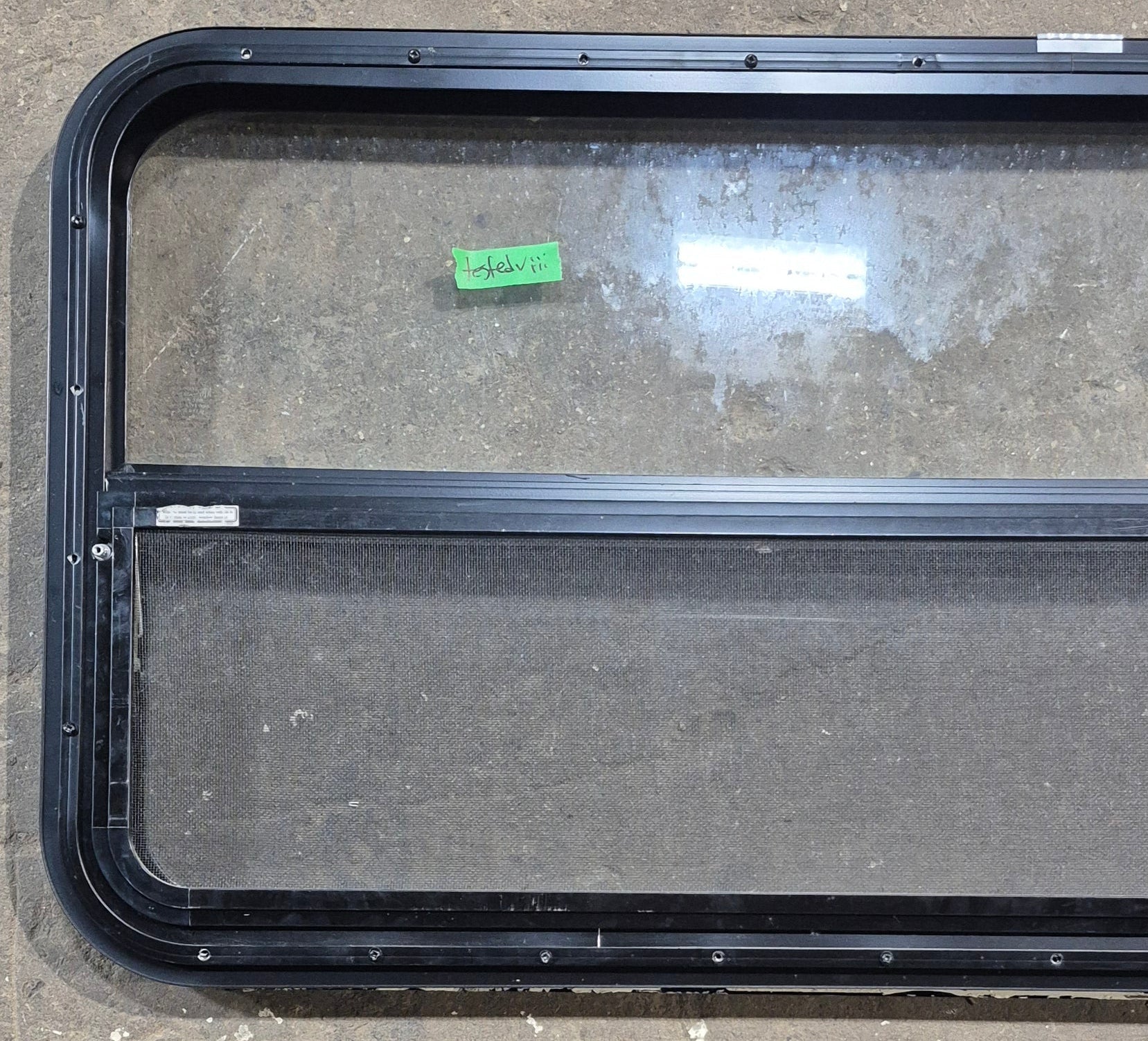 Used Black Radius Opening Window : 47 1/2" W x 21 1/4" H x 1 1/4" D - Young Farts RV Parts