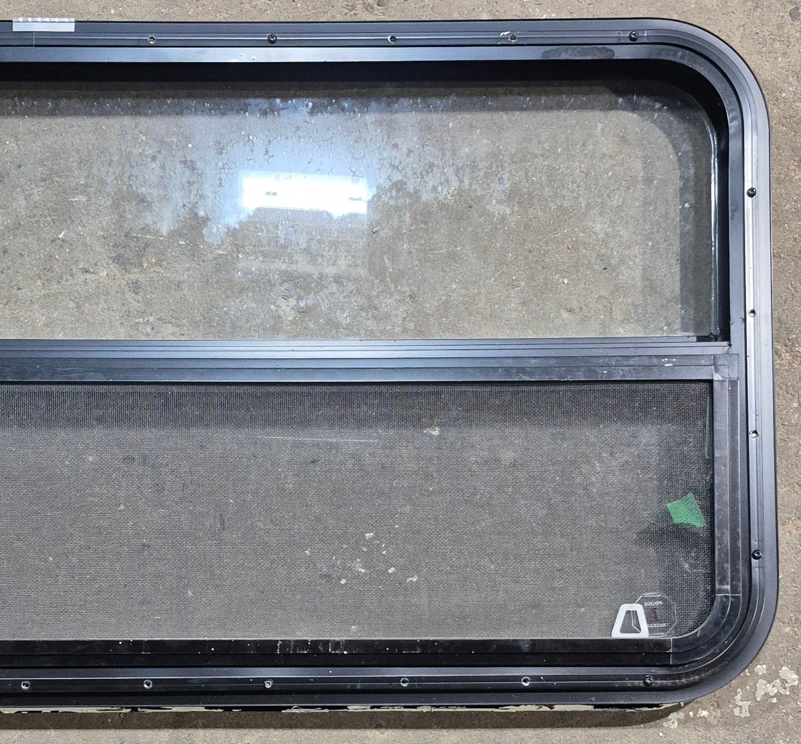 Used Black Radius Opening Window : 47 1/2" W x 21 1/4" H x 1 1/4" D - Young Farts RV Parts