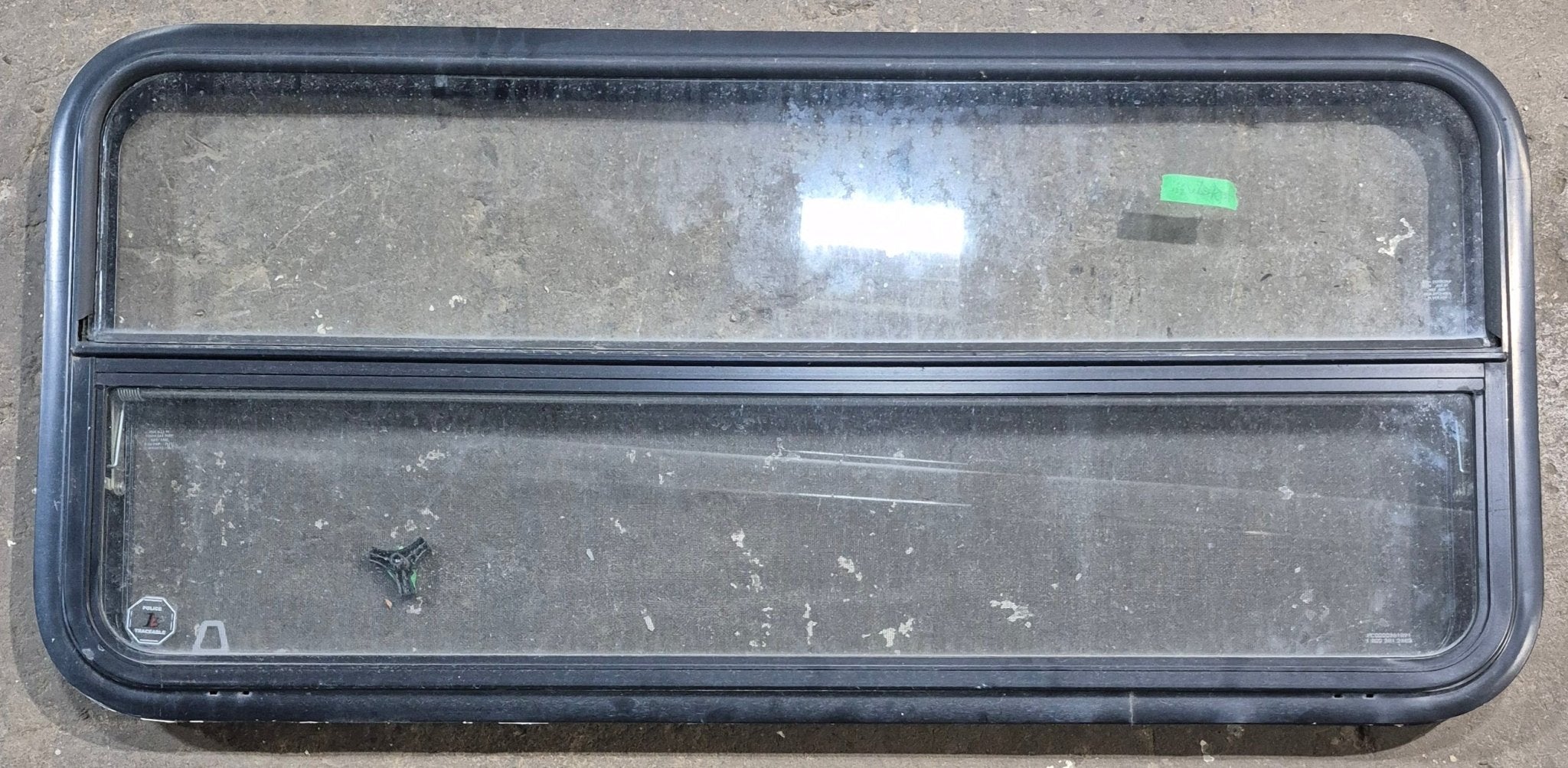 Used Black Radius Opening Window : 47 1/2" W x 21 1/4" H x 1 1/4" D - Young Farts RV Parts