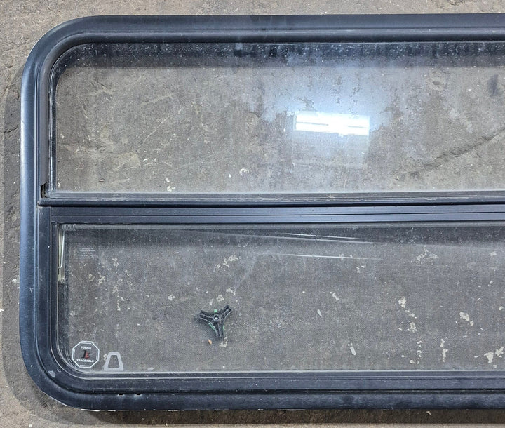 Used Black Radius Opening Window : 47 1/2" W x 21 1/4" H x 1 1/4" D - Young Farts RV Parts