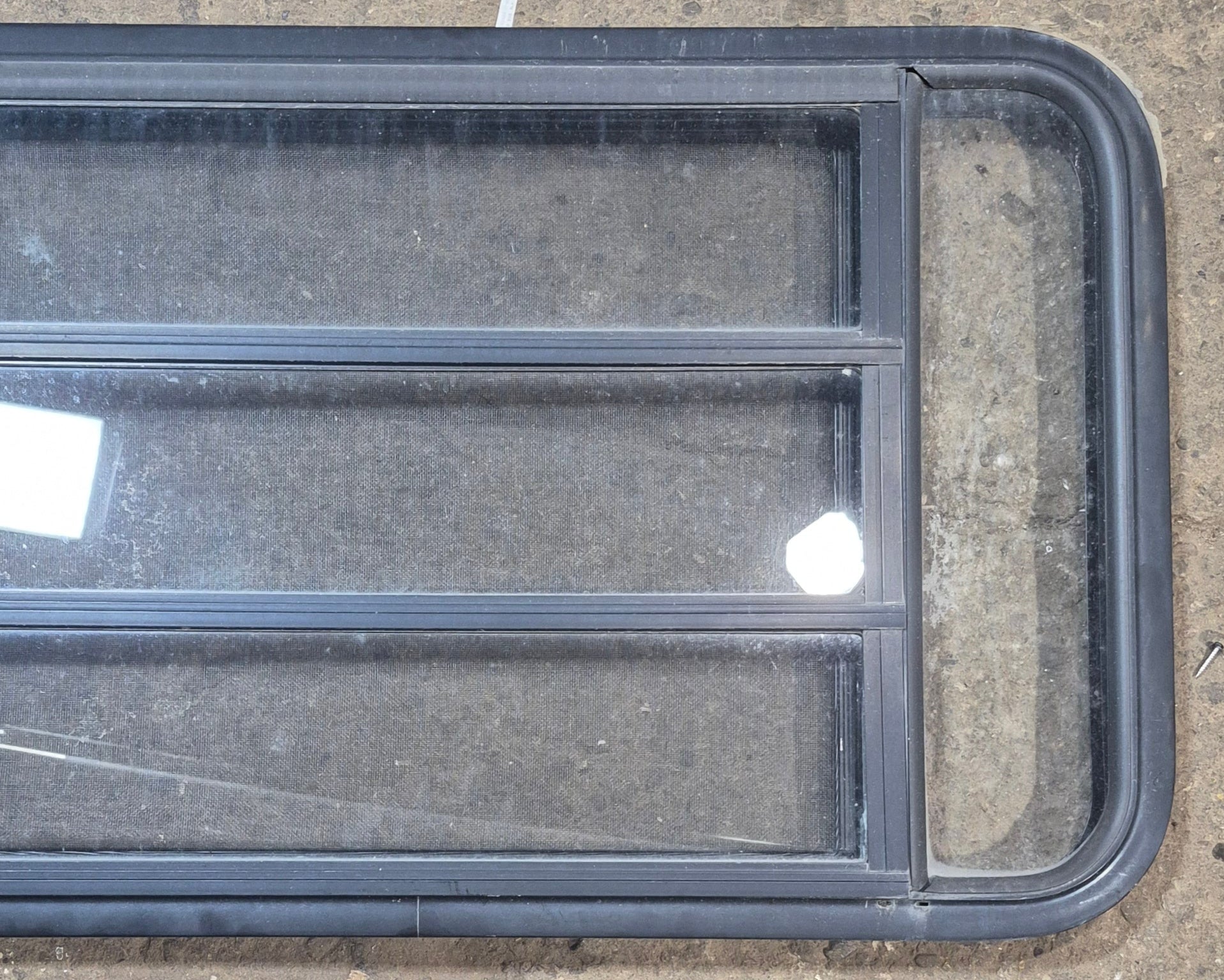 Used Black Radius Opening Window : 47 1/2" W x 22 1/4" H x 1 3/4" - Young Farts RV Parts