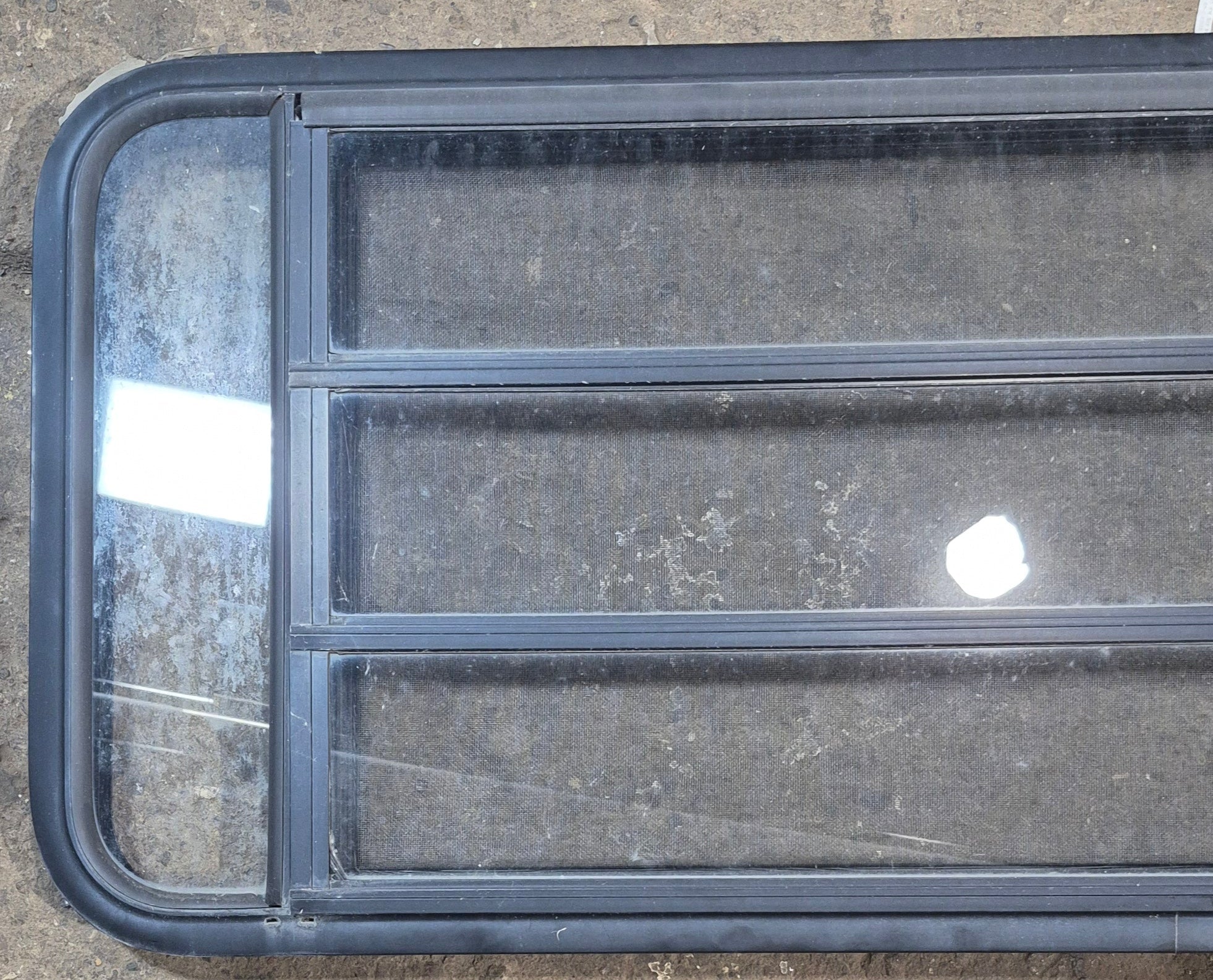 Used Black Radius Opening Window : 47 1/2" W x 22 1/4" H x 1 3/4" - Young Farts RV Parts