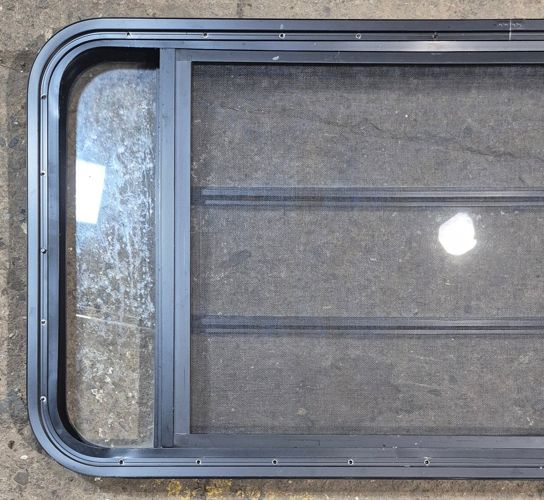 Used Black Radius Opening Window : 47 1/2" W x 22 1/4" H x 1 3/4" - Young Farts RV Parts