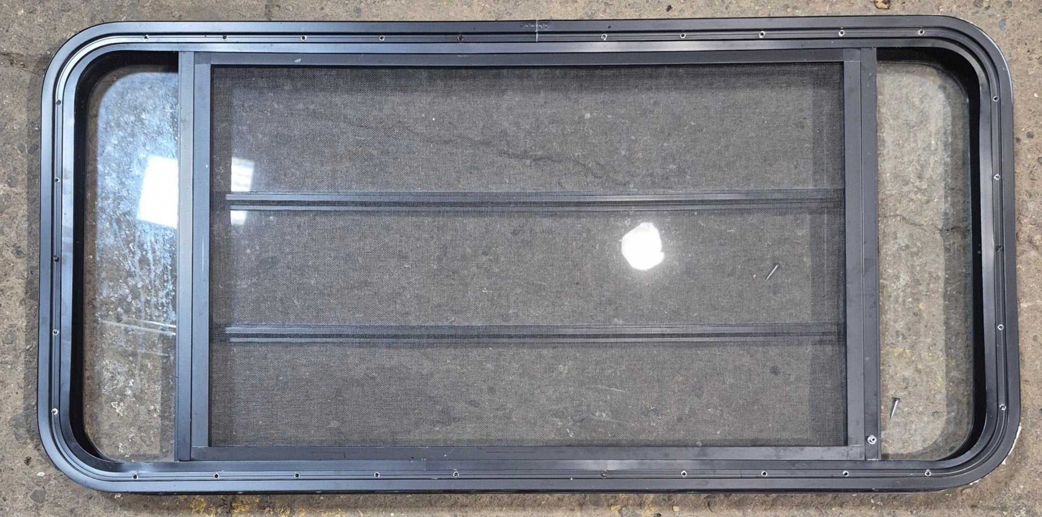 Used Black Radius Opening Window : 47 1/2" W x 22 1/4" H x 1 3/4" - Young Farts RV Parts