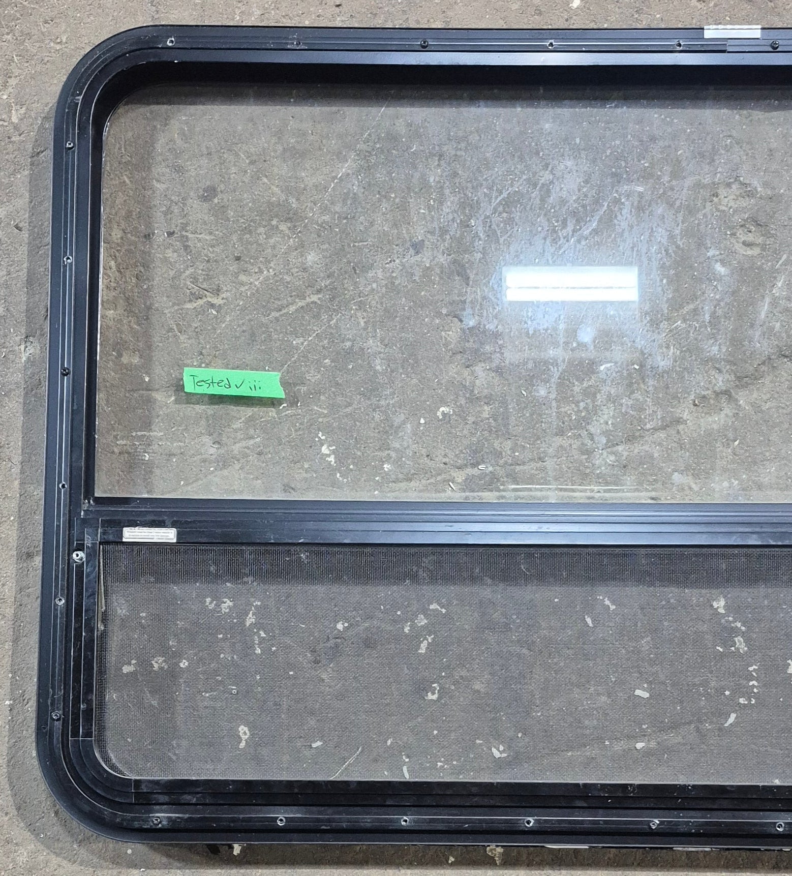 Used Black Radius Opening Window : 47 1/2" W x 28 1/4" H x 1 1/4" D - Young Farts RV Parts