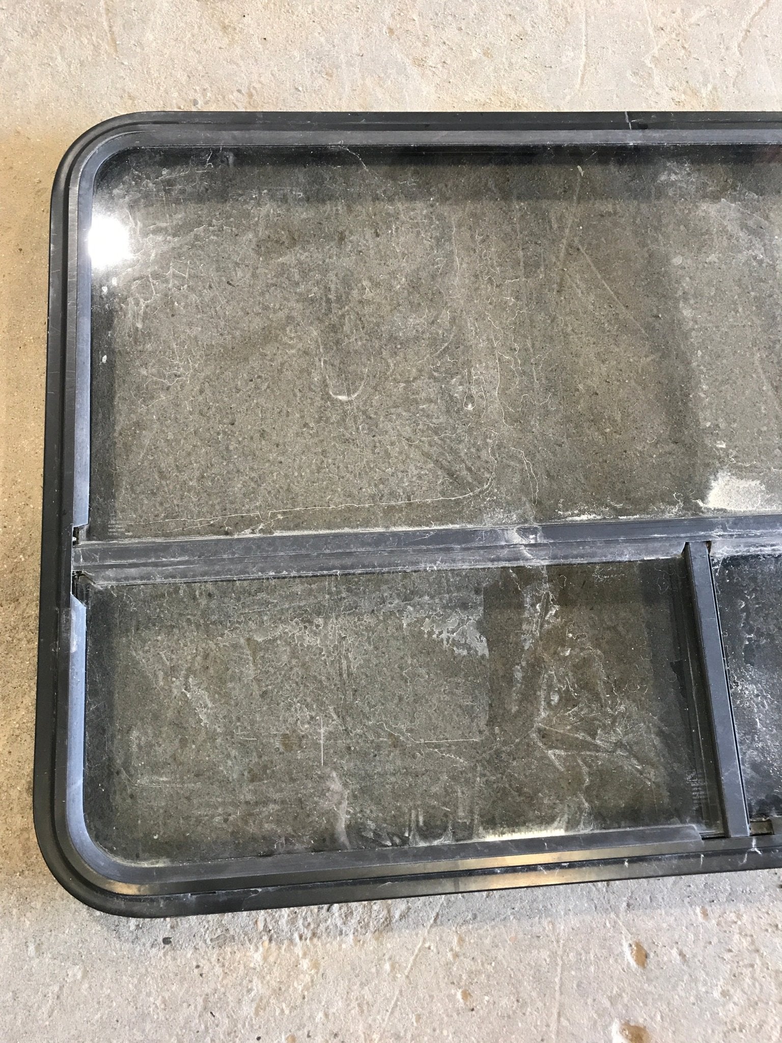 Used Black Radius Opening Window : 47 1/2" W x 30" H x 2" D - Young Farts RV Parts