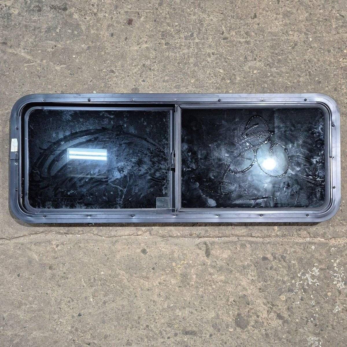 Used Black Radius Opening Window - 47 1/2" X 17 1/2" X 1 7/8" - Young Farts RV Parts