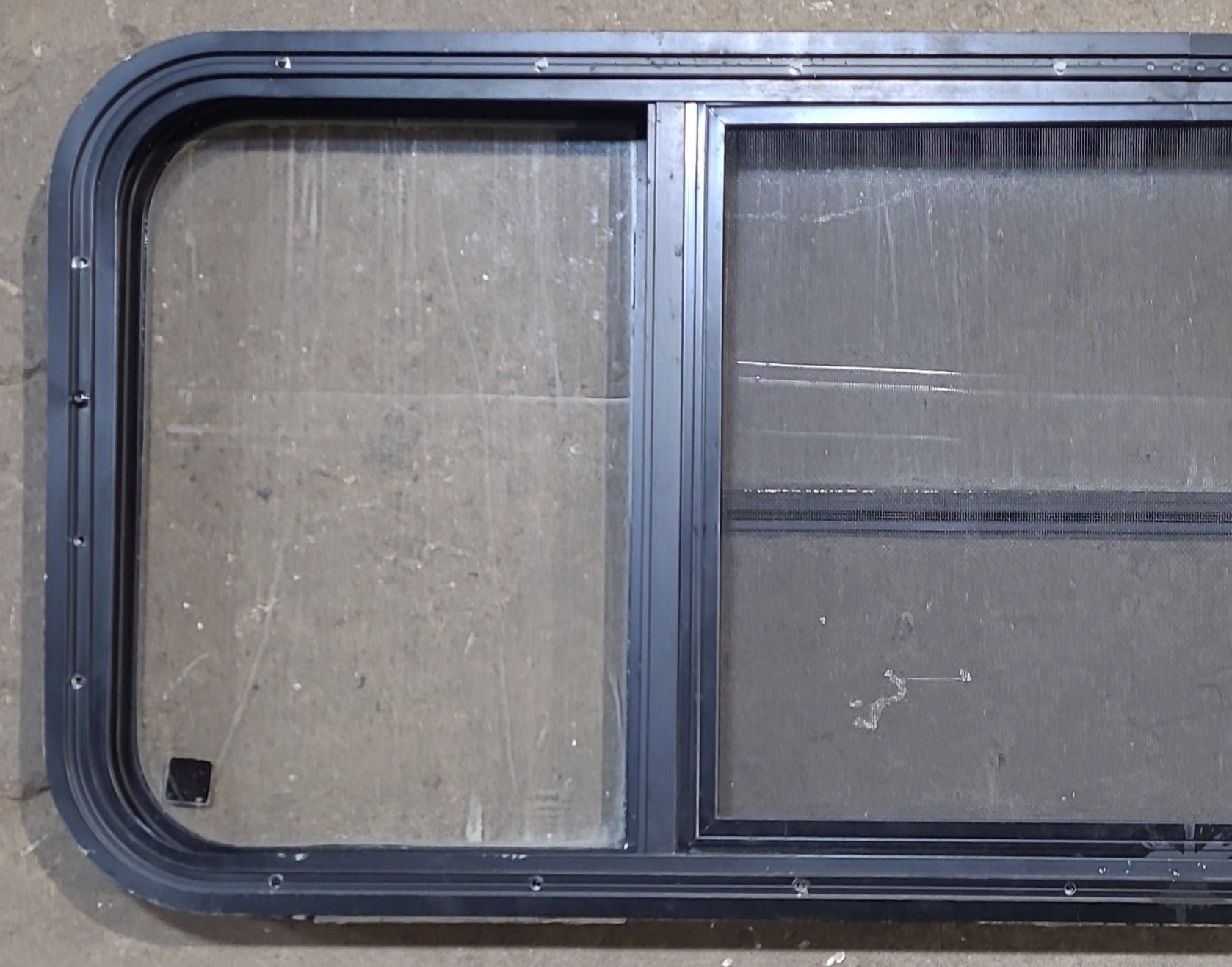 Used Black Radius Opening Window : 47 1/4" W x 17 1/2" H x 1 7/8" D - Young Farts RV Parts