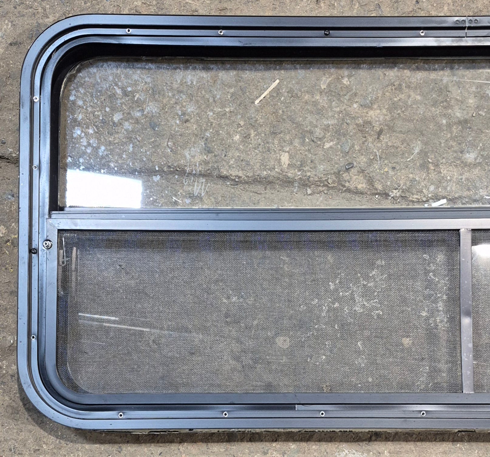 Used Black Radius Opening Window : 47 1/4" W x 21 1/4" H x 1 7/8" - Young Farts RV Parts