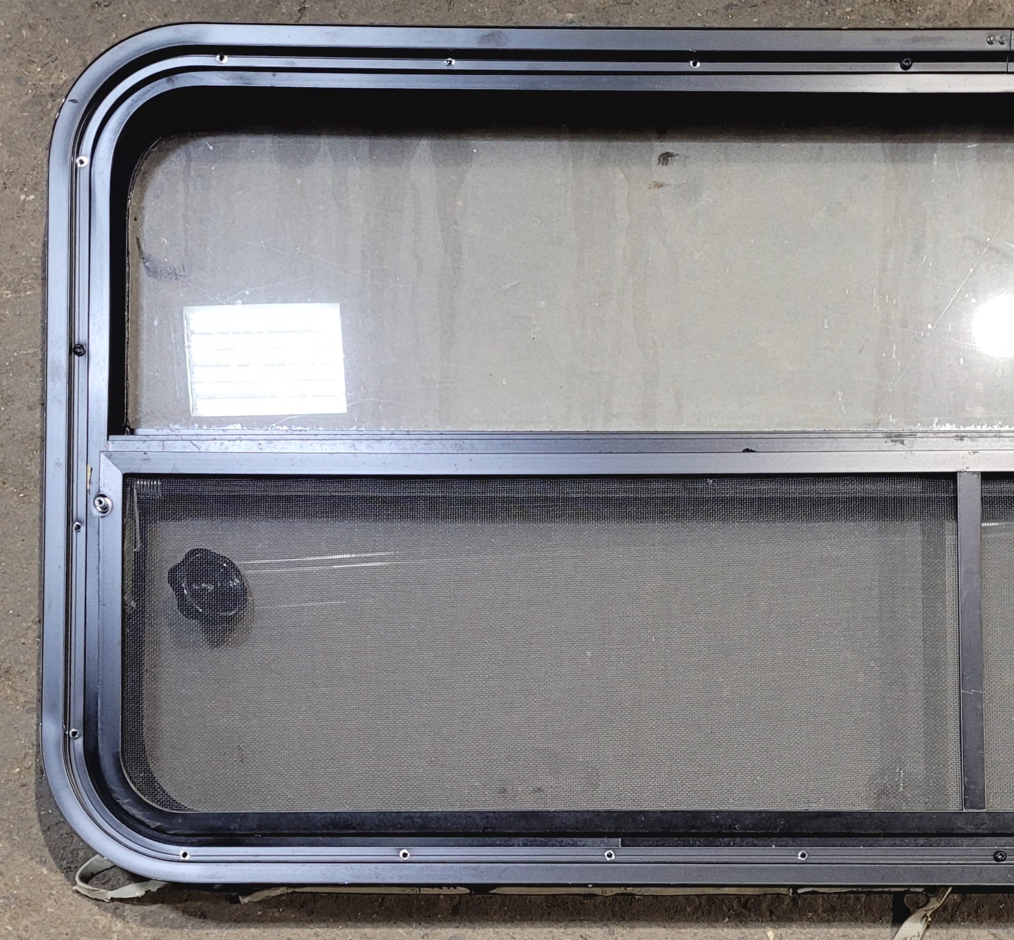 Used Black Radius Opening Window : 47 1/4" W x 21 1/4" H x 1 7/8" - Young Farts RV Parts