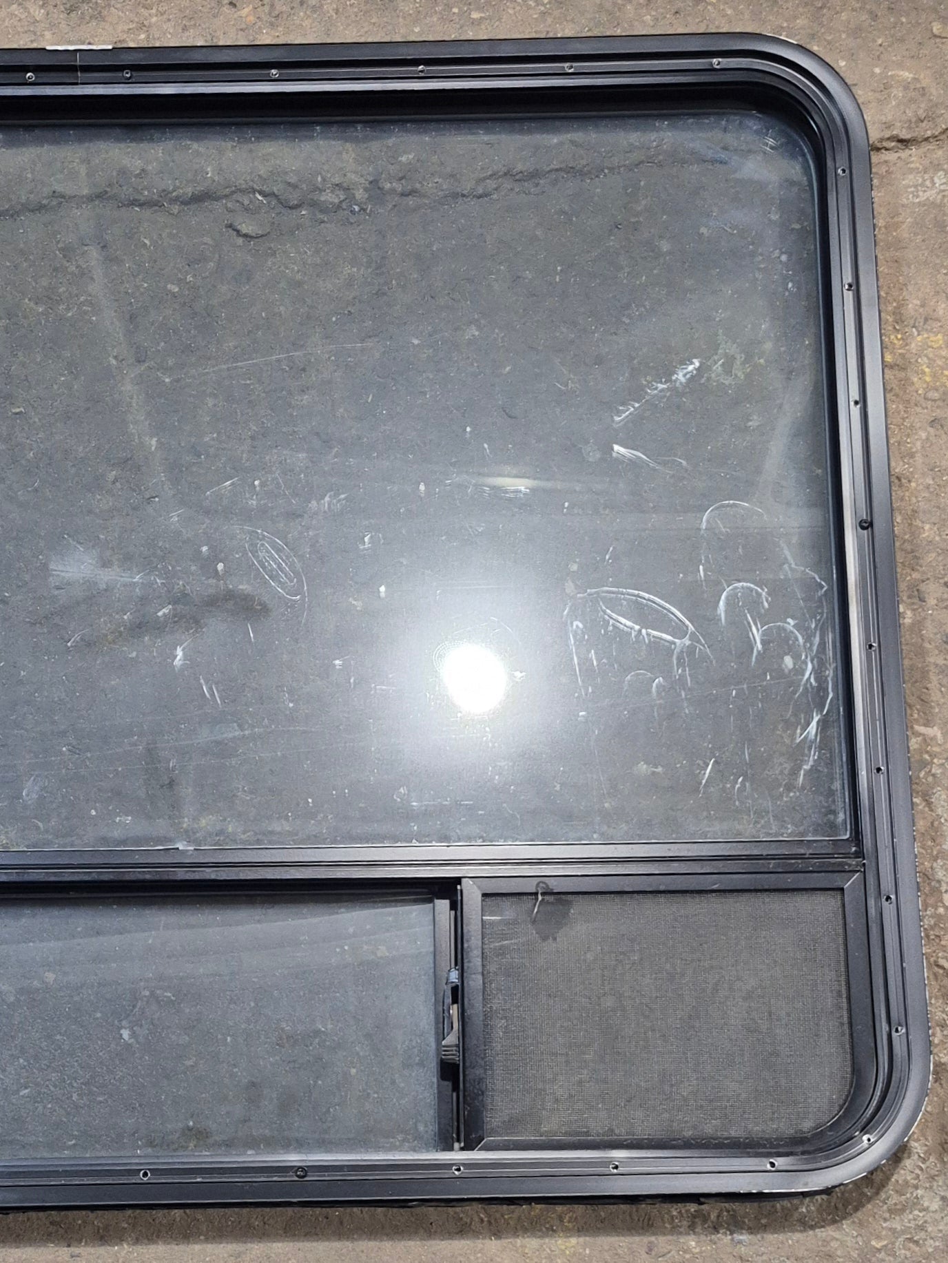 Used Black Radius Opening Window : 47 1/4" W x 34 1/4" H x 1 3/4" D - Young Farts RV Parts