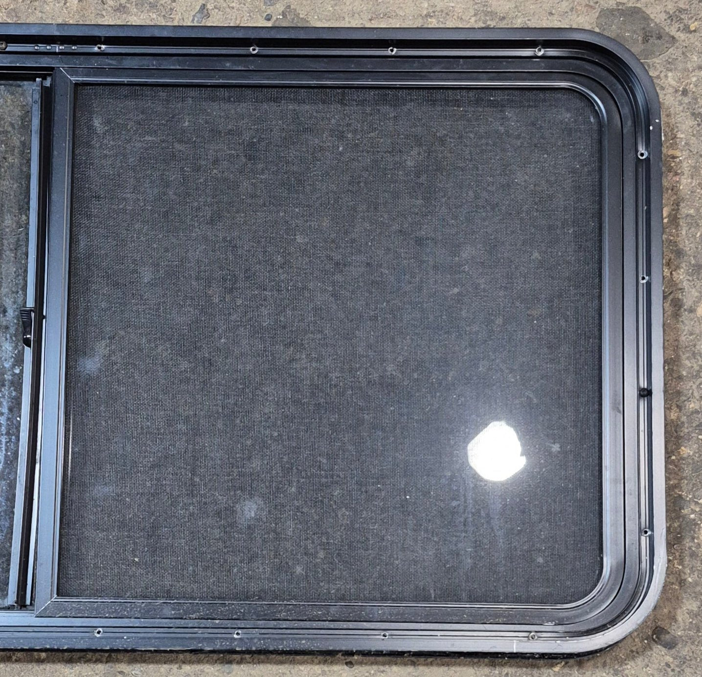 Used Black Radius Opening Window : 47 3/4" W x 23 3/4" H x 1 7/8" - Young Farts RV Parts
