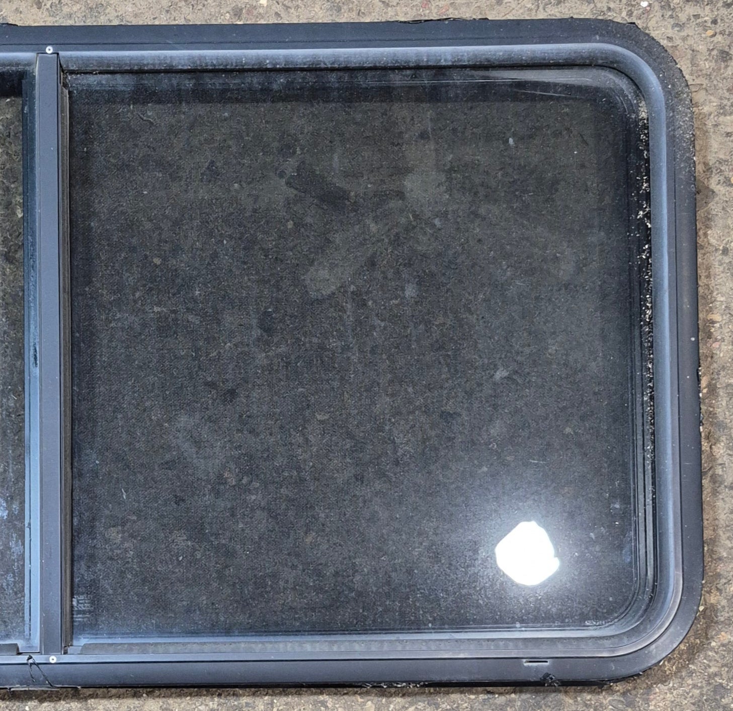 Used Black Radius Opening Window : 47 3/4" W x 23 3/4" H x 1 7/8" - Young Farts RV Parts
