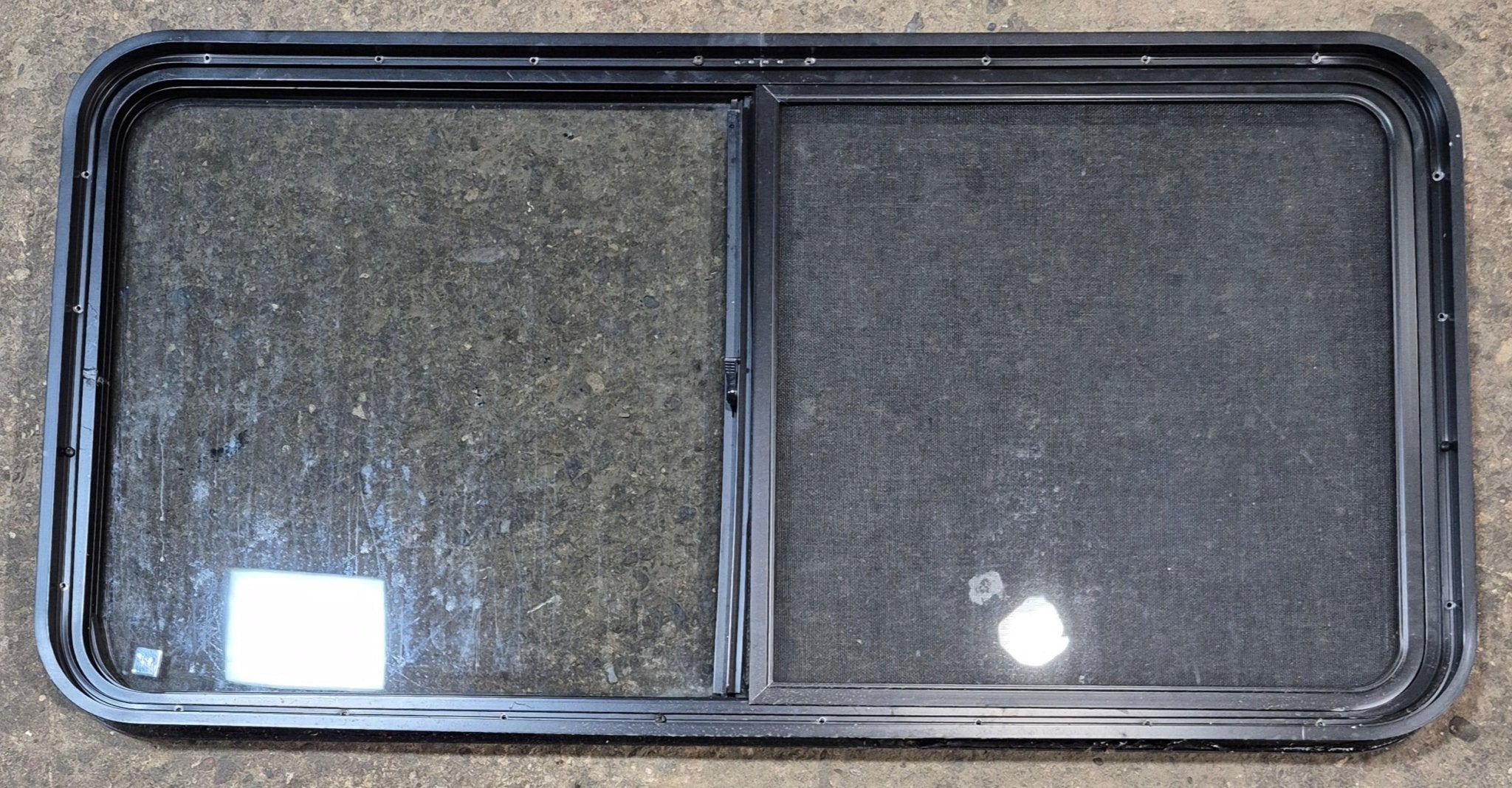 Used Black Radius Opening Window : 47 3/4" W x 23 3/4" H x 1 7/8" - Young Farts RV Parts