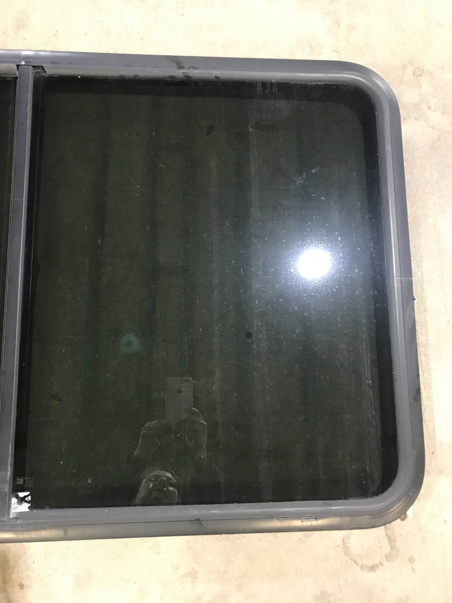 Used Black Radius Opening Window : 47 5/8" W x 28 1/2" H x 1 7/8" D - Young Farts RV Parts