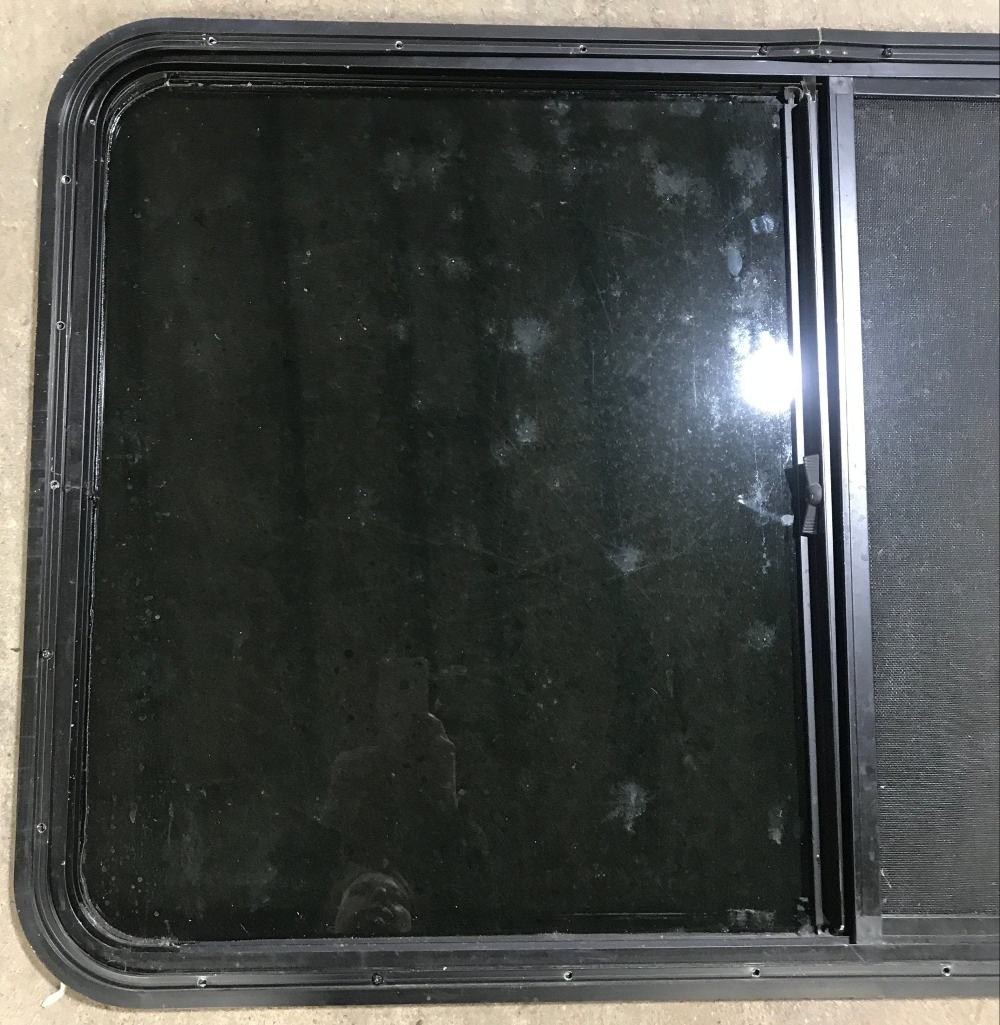 Used Black Radius Opening Window : 47 5/8" W x 28 1/2" H x 1 7/8" D - Young Farts RV Parts