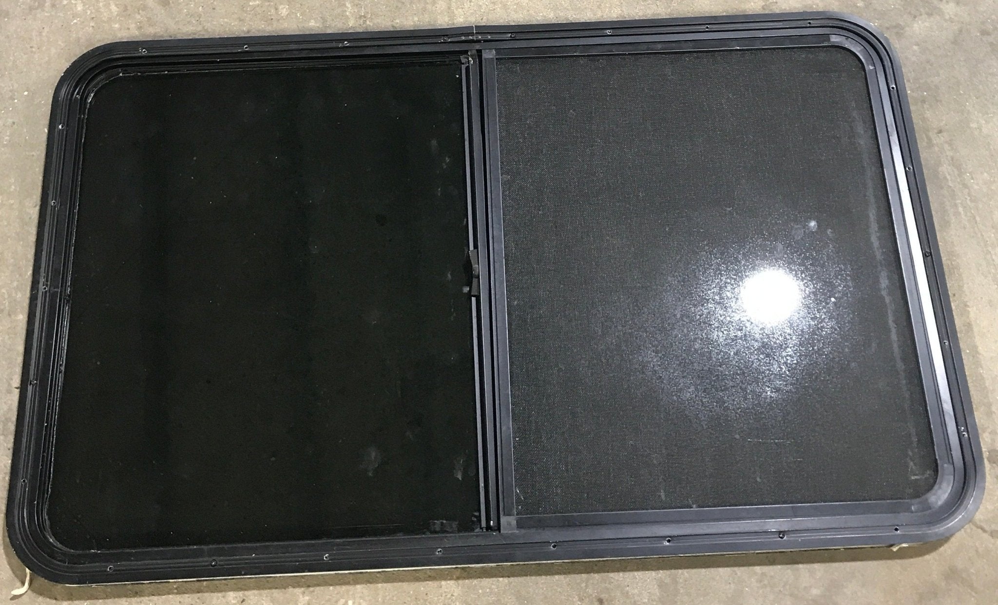 Used Black Radius Opening Window : 47 5/8" W x 28 1/2" H x 1 7/8" D - Young Farts RV Parts
