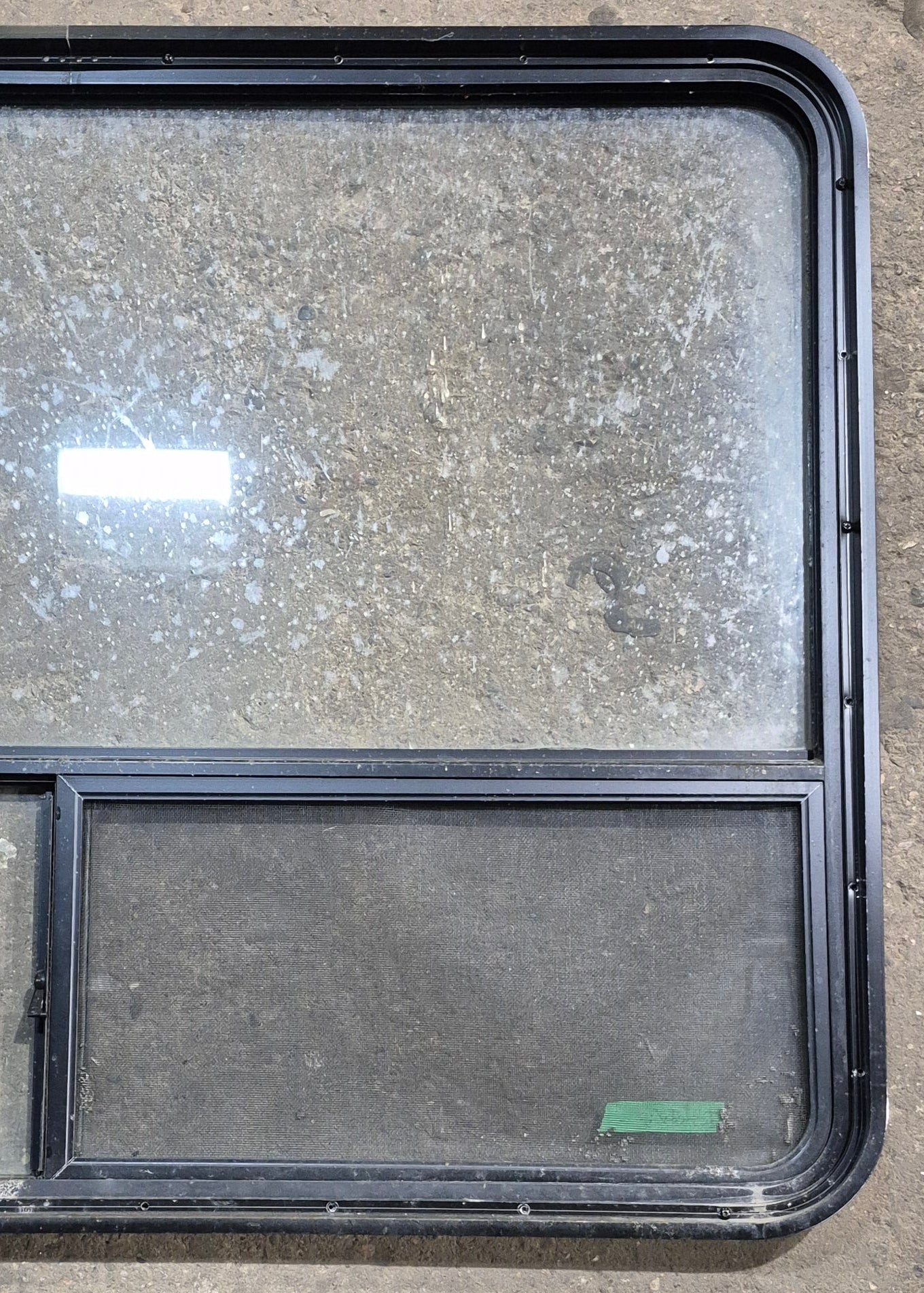 Used Black Radius Opening Window : 48 1/4" W x 35 3/4" H x 1 5/8" D - Young Farts RV Parts