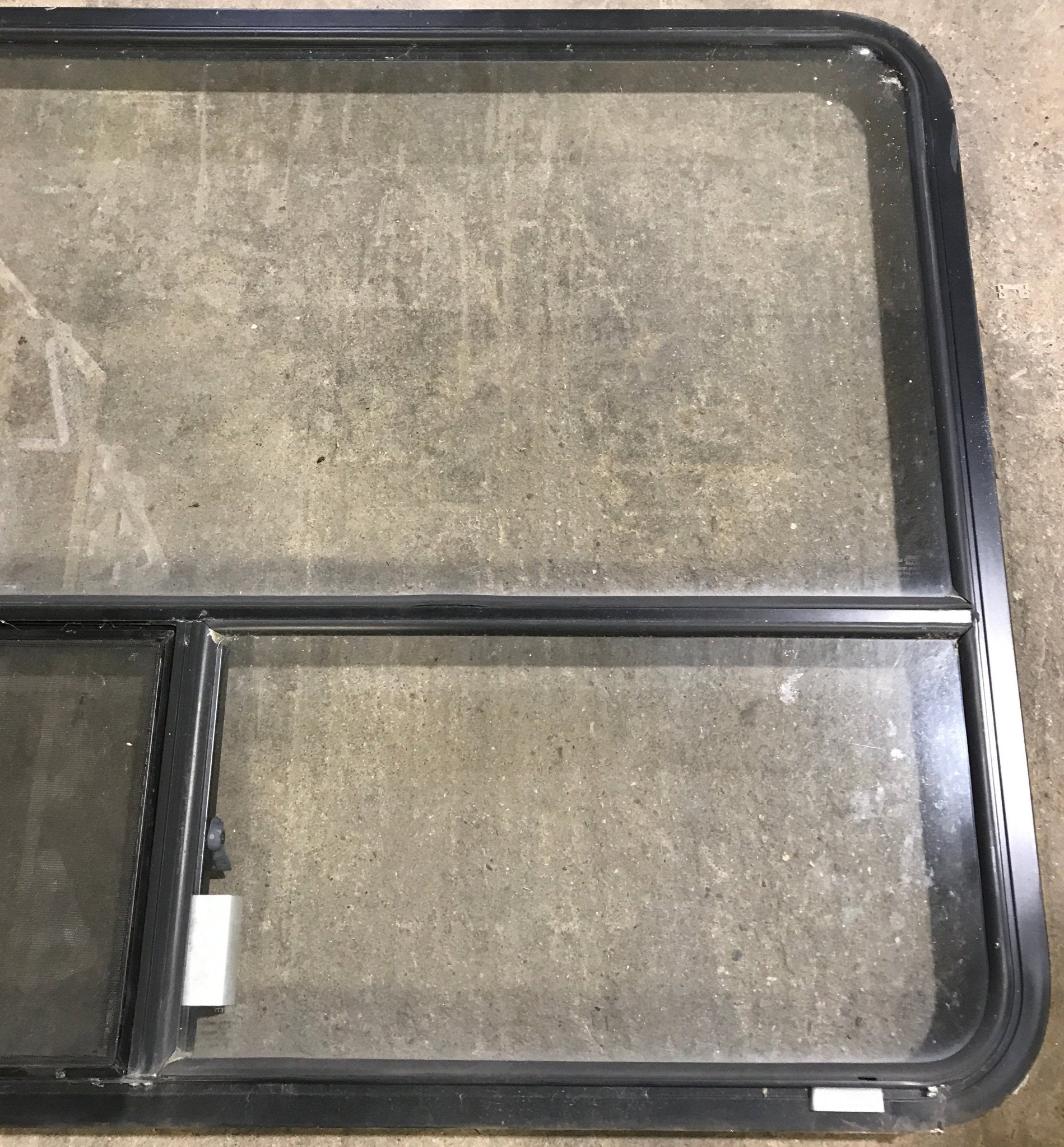 Used Black Radius Opening Window : 48 1/4" W x 35 3/4" H x 1 7/8" D - Young Farts RV Parts