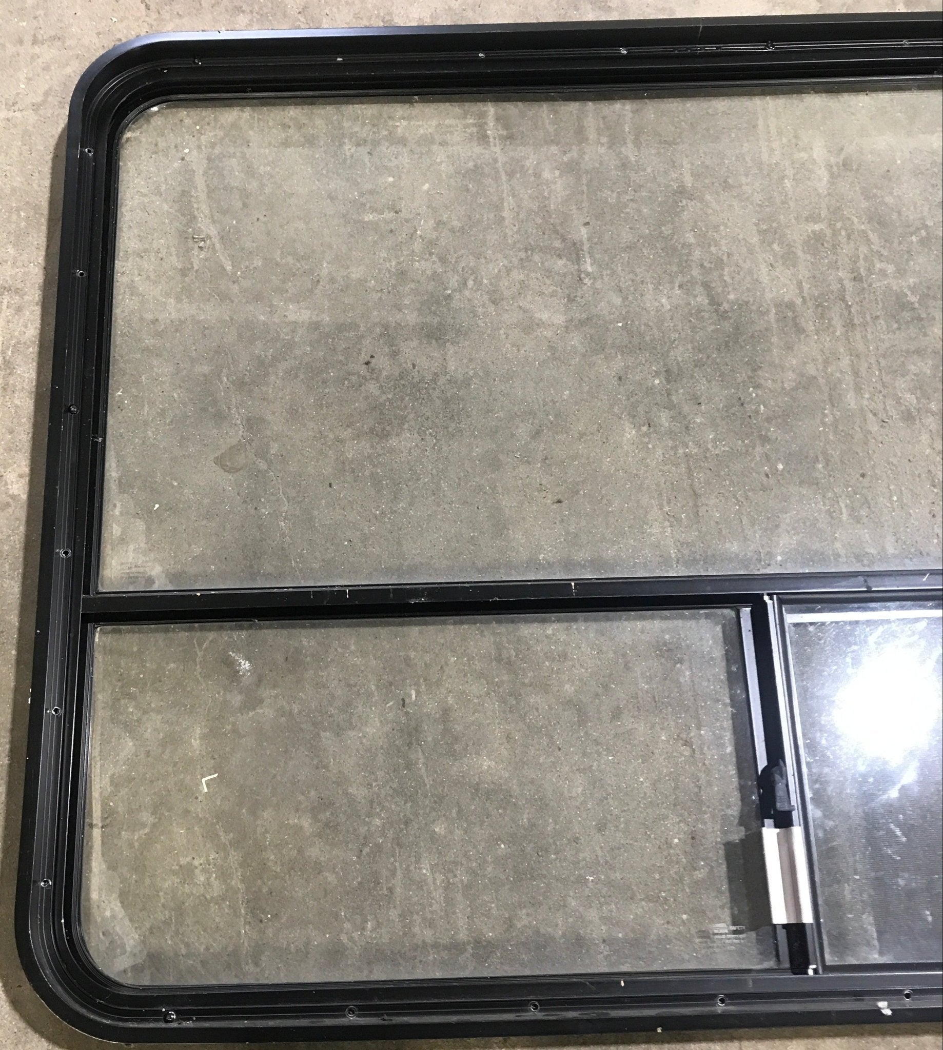 Used Black Radius Opening Window : 48 1/4" W x 35 3/4" H x 1 7/8" D - Young Farts RV Parts