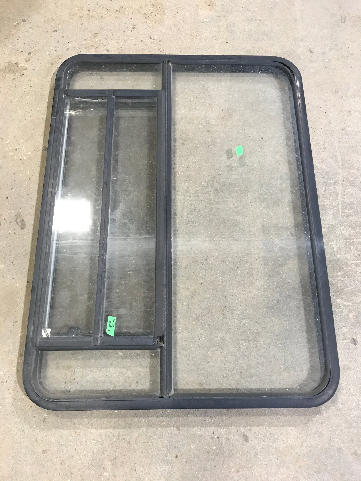 Used Black Radius Opening Window : 48" W x 34 1/2" H x 2" D - Young Farts RV Parts