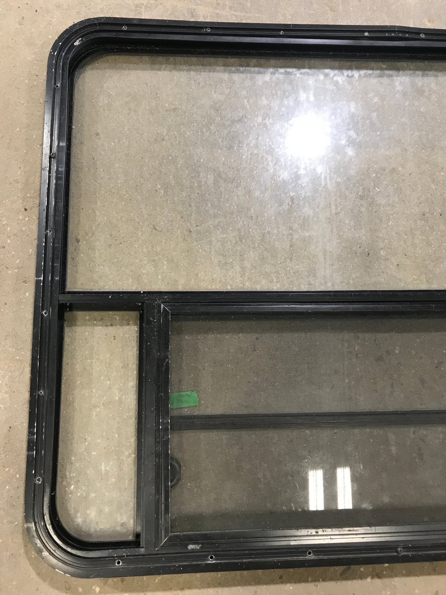 Used Black Radius Opening Window : 48" W x 34 1/2" H x 2" D - Young Farts RV Parts