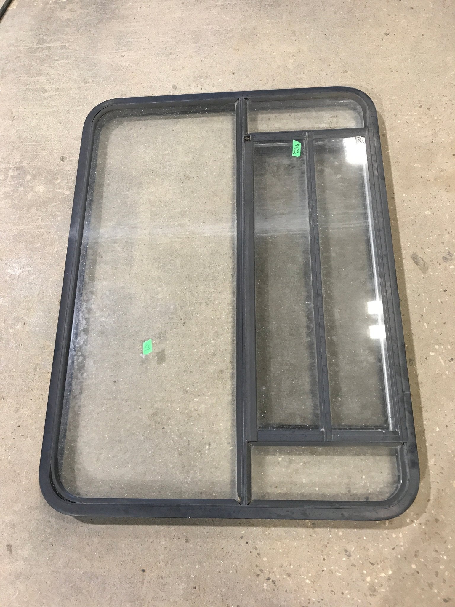 Used Black Radius Opening Window : 48" W x 34 1/2" H x 2" D - Young Farts RV Parts