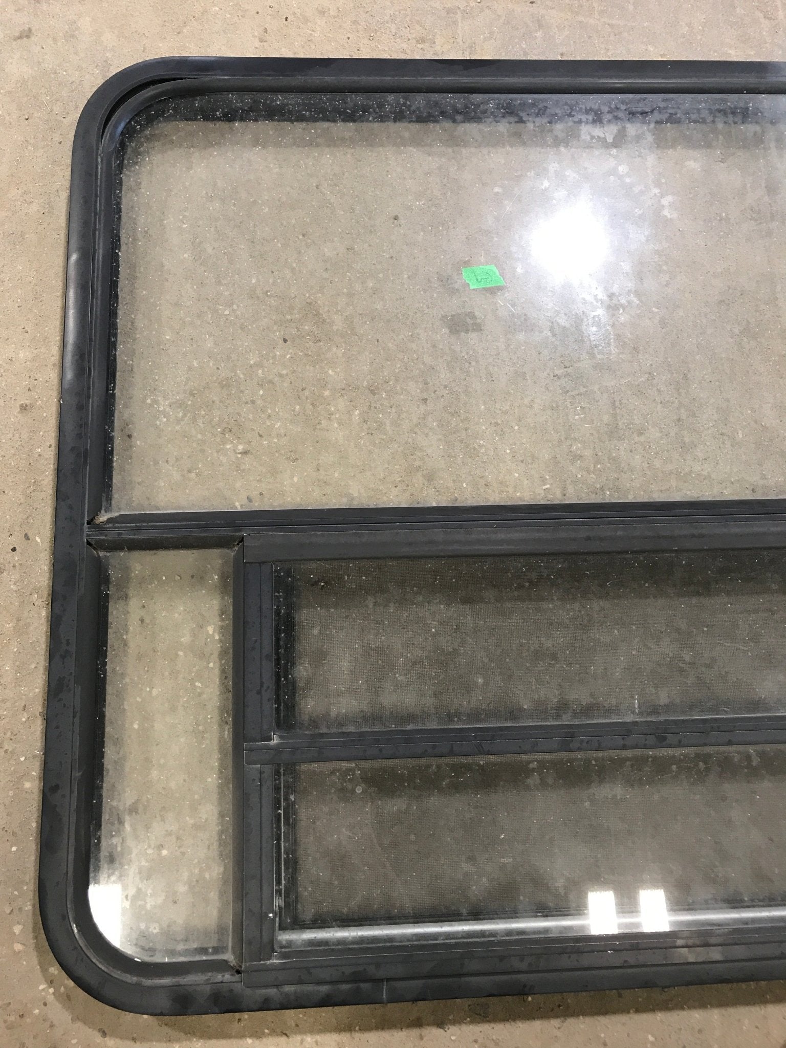 Used Black Radius Opening Window : 48" W x 34 1/2" H x 2" D - Young Farts RV Parts