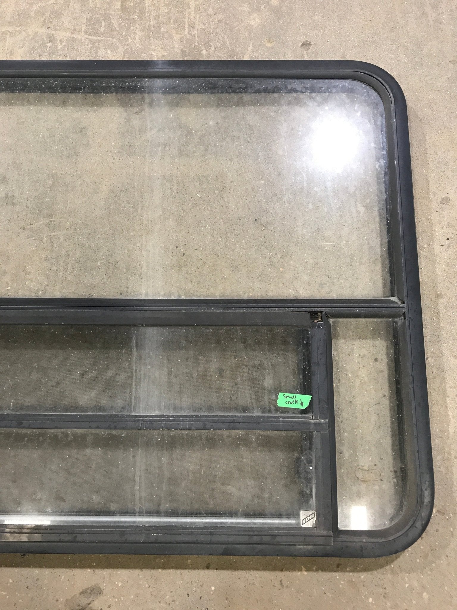 Used Black Radius Opening Window : 48" W x 34 1/2" H x 2" D - Young Farts RV Parts