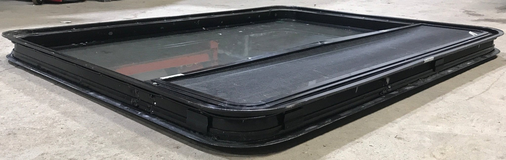Used Black Radius Opening Window : 48" W x 35 1/2" H x 2" D - Young Farts RV Parts