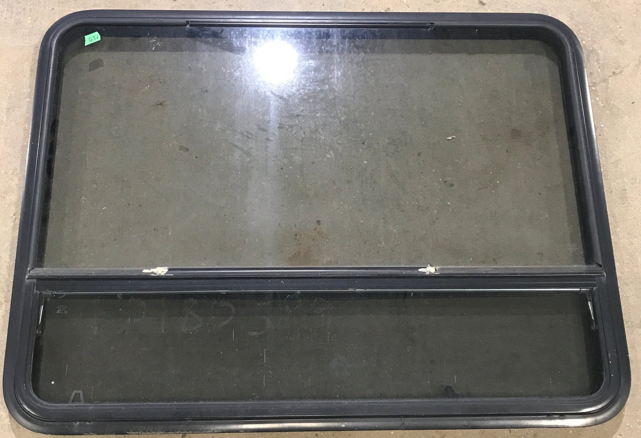 Used Black Radius Opening Window : 48" W x 35 1/2" H x 2" D - Young Farts RV Parts
