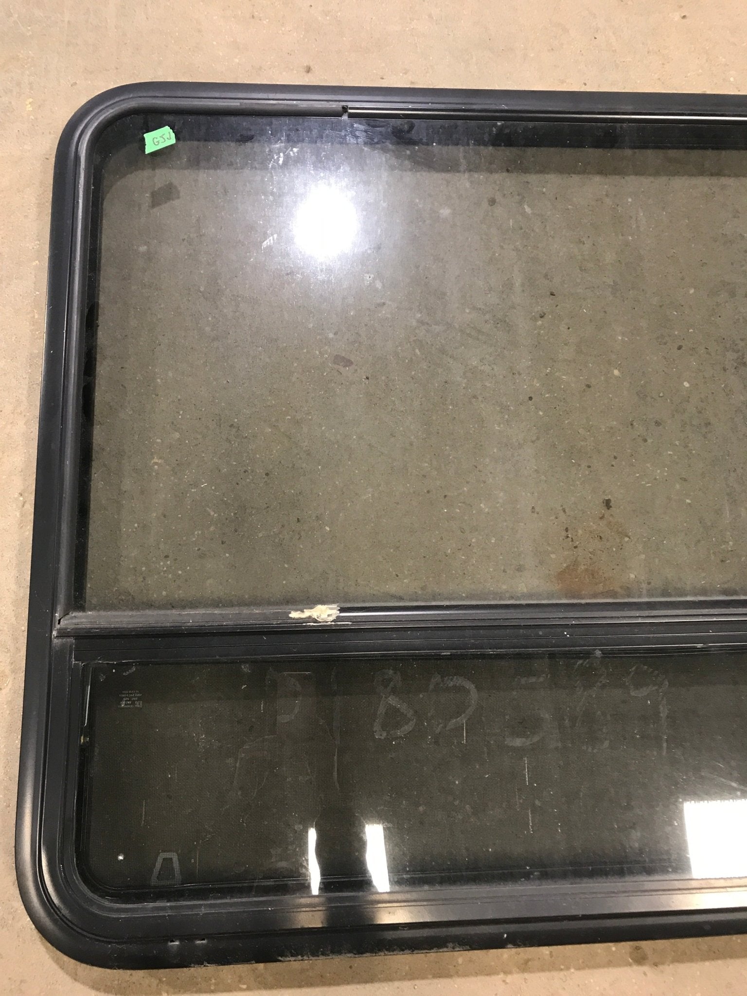 Used Black Radius Opening Window : 48" W x 35 1/2" H x 2" D - Young Farts RV Parts