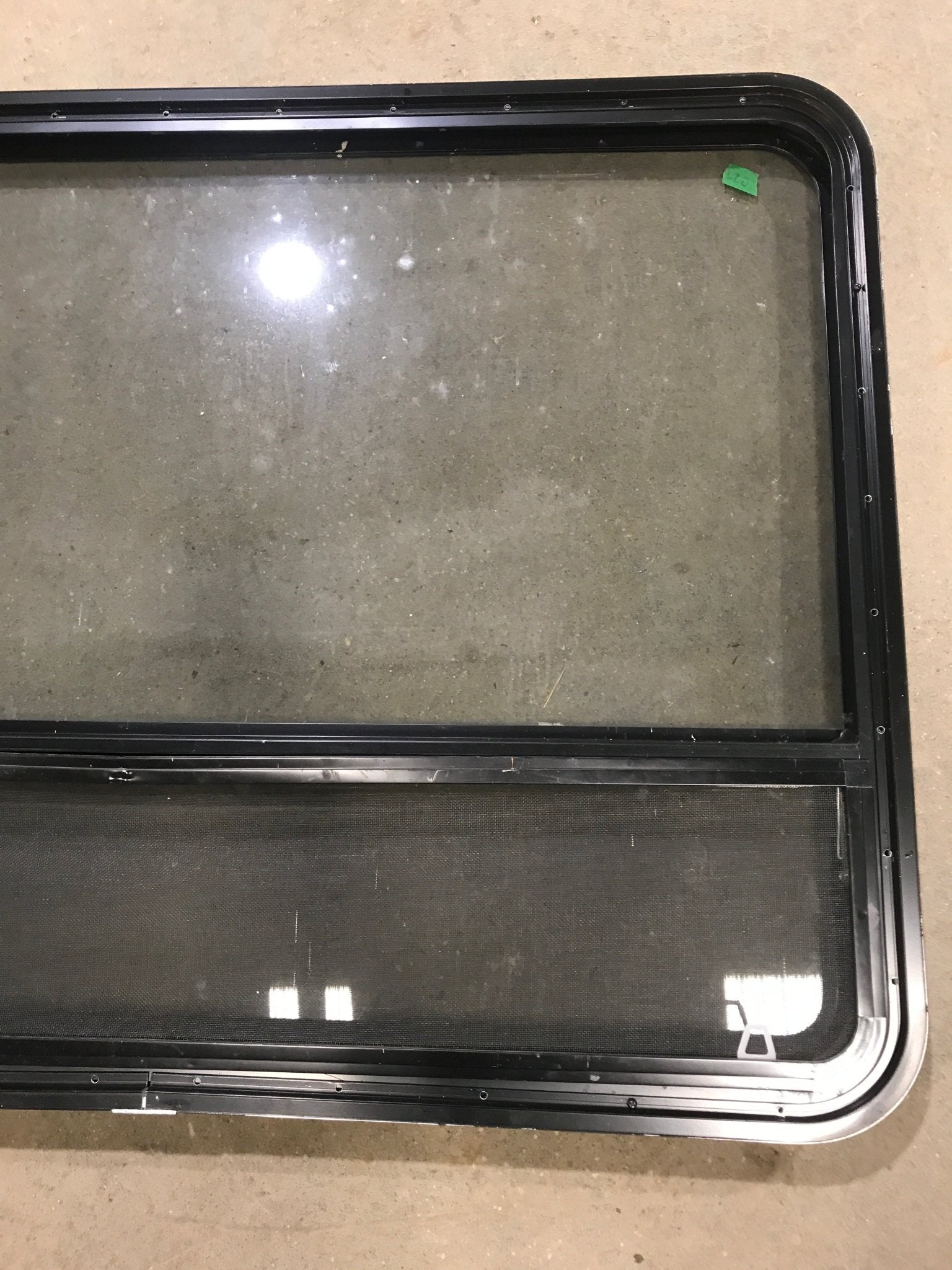 Used Black Radius Opening Window : 48" W x 35 1/2" H x 2" D - Young Farts RV Parts