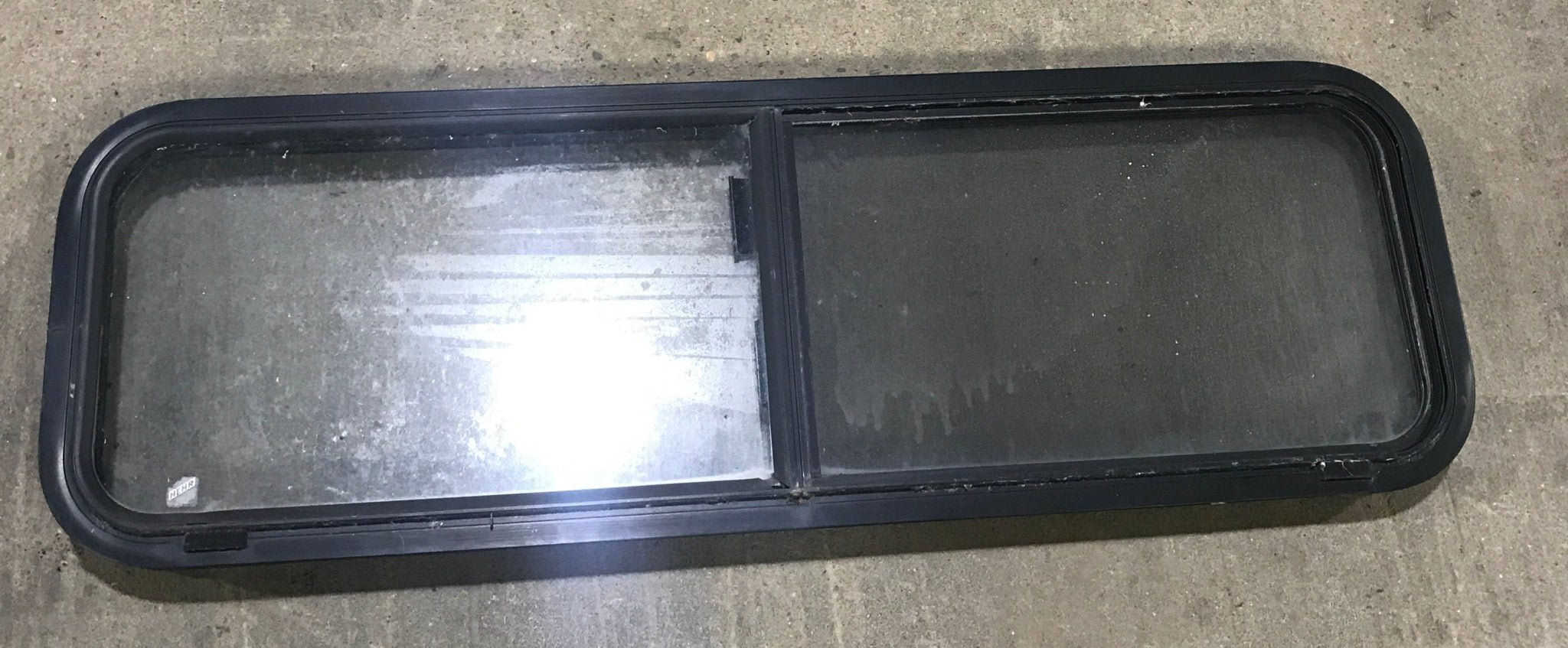 Used Black Radius Opening Window : 49" W x 15 1/4" H x 2" D - Young Farts RV Parts