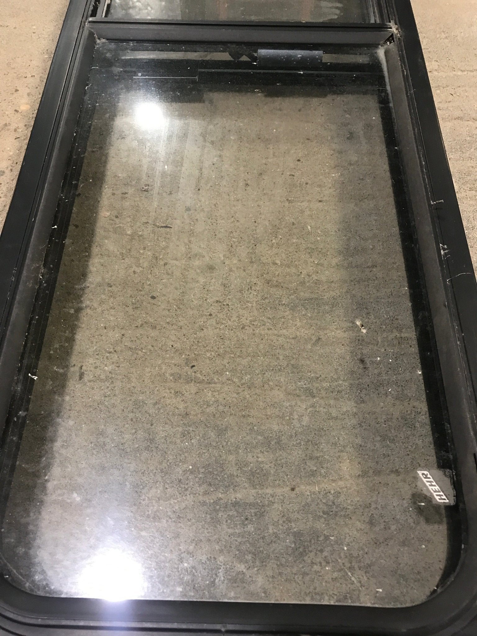 Used Black Radius Opening Window : 49" W x 15 1/4" H x 2" D - Young Farts RV Parts