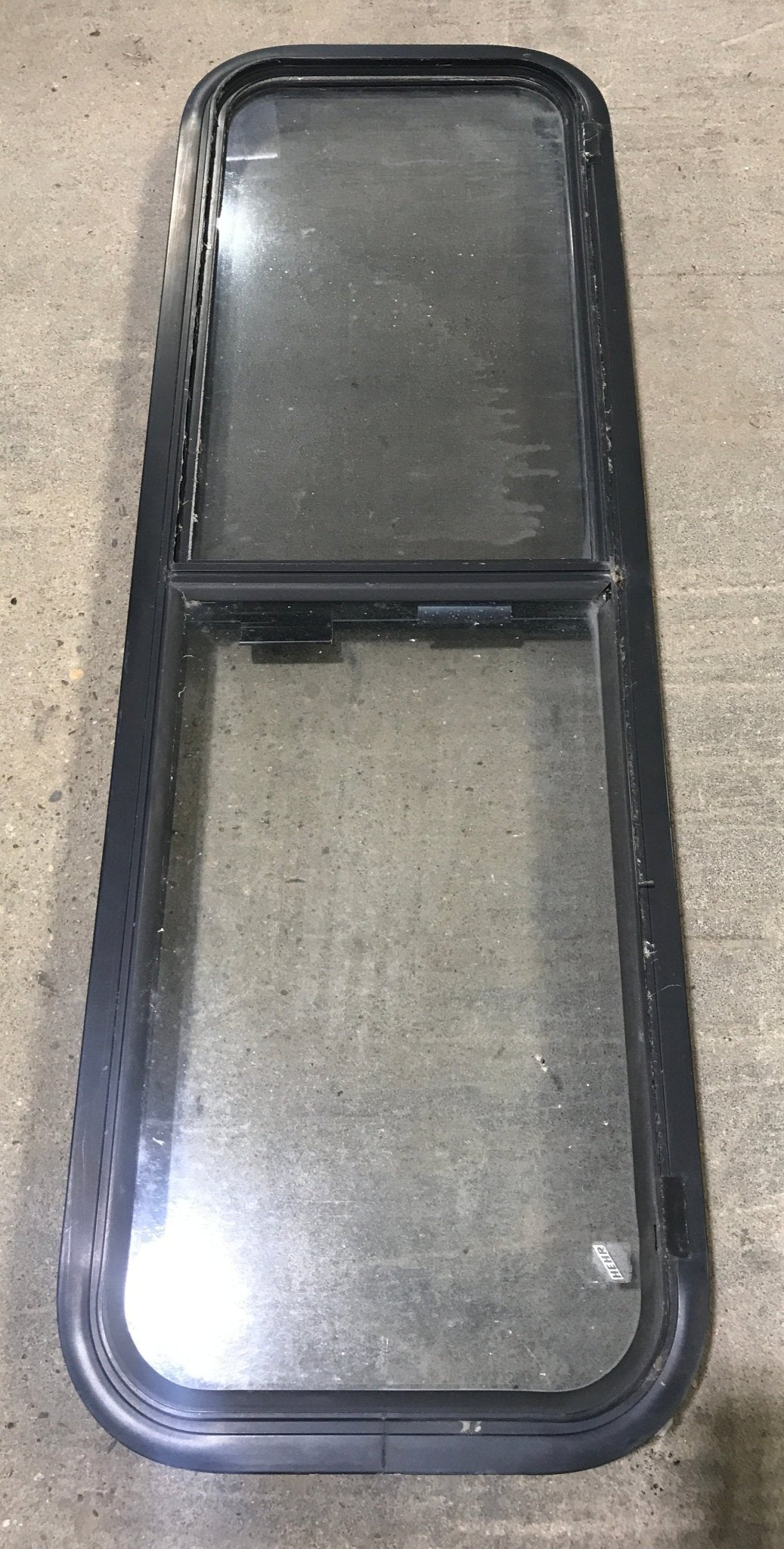 Used Black Radius Opening Window : 49" W x 15 1/4" H x 2" D - Young Farts RV Parts