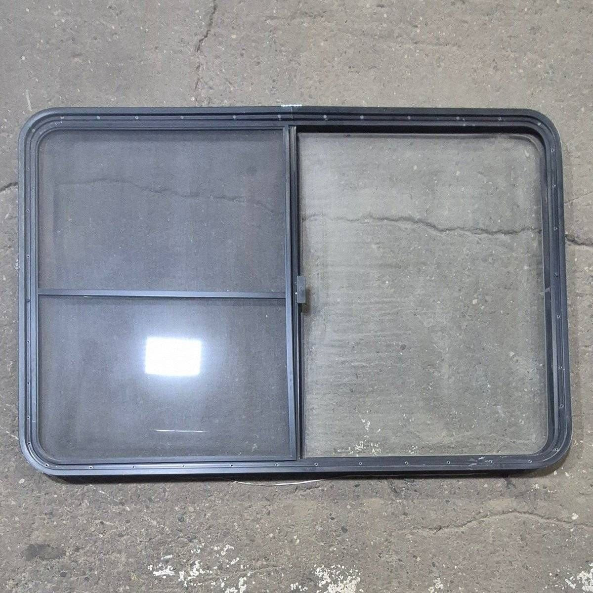 Used Black Radius Opening Window - 53 1/2" X 35 1/2" X 1 1/4" - Young Farts RV Parts