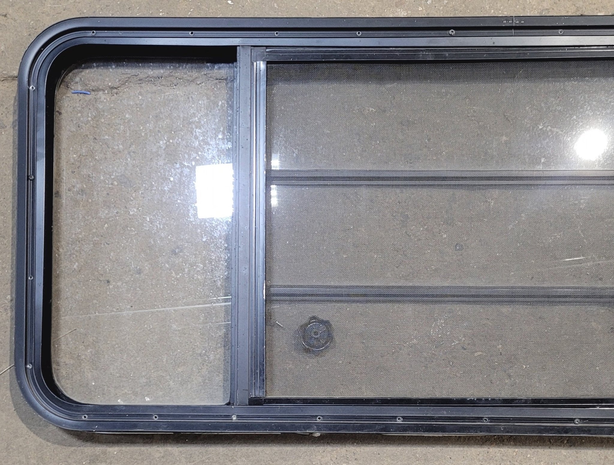 Used Black Radius Opening Window : 53 1/4" W x 22 1/4" H x 1 7/8" - Young Farts RV Parts