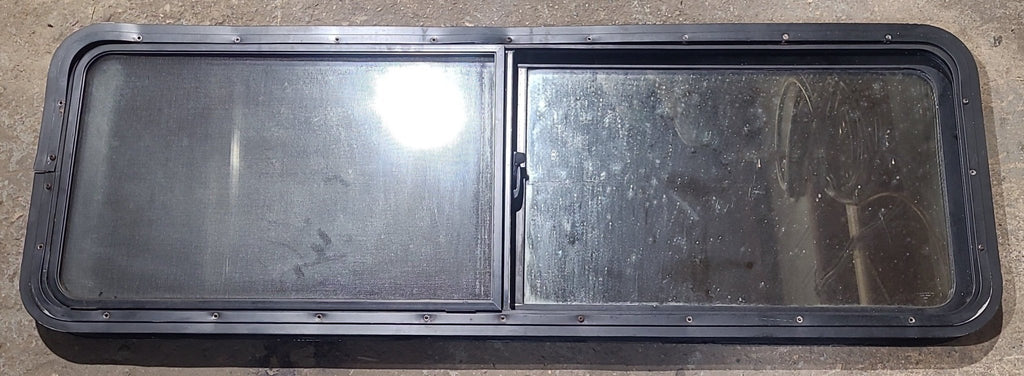 Used Black Radius Opening Window : 54" W x 17 1/2" H x 2" D - Young Farts RV Parts