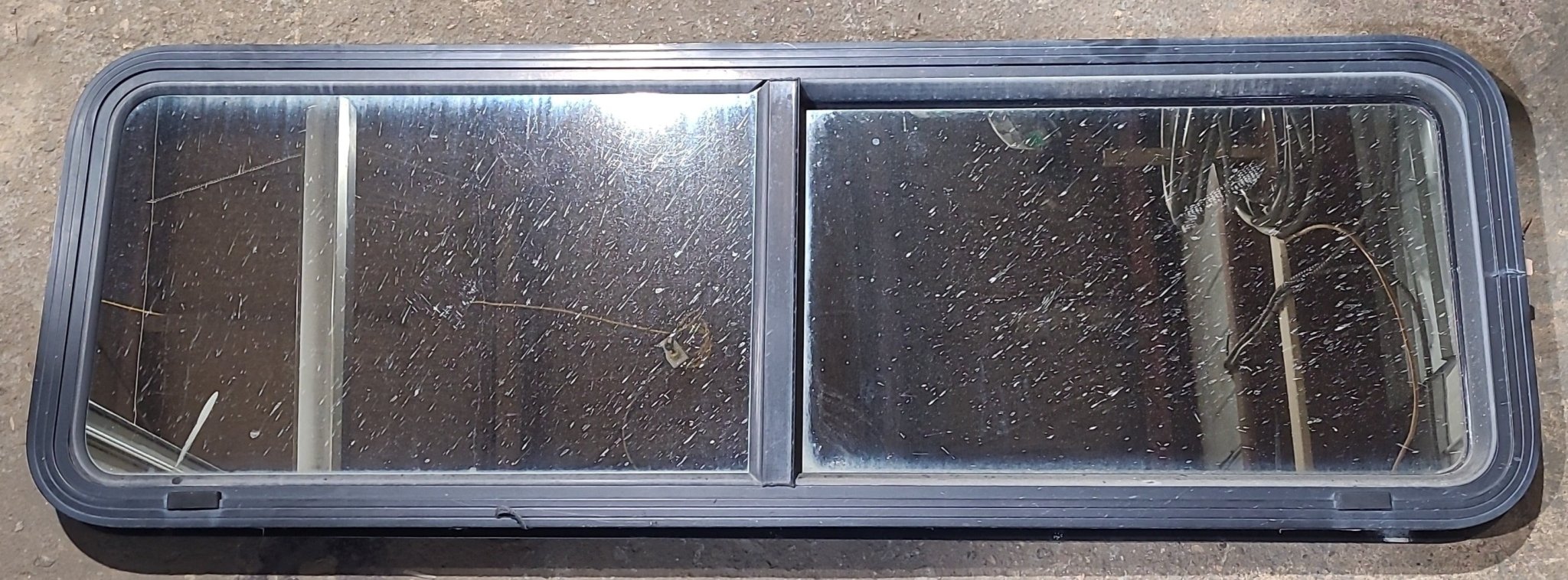 Used Black Radius Opening Window : 54" W x 17 1/2" H x 2" D - Young Farts RV Parts