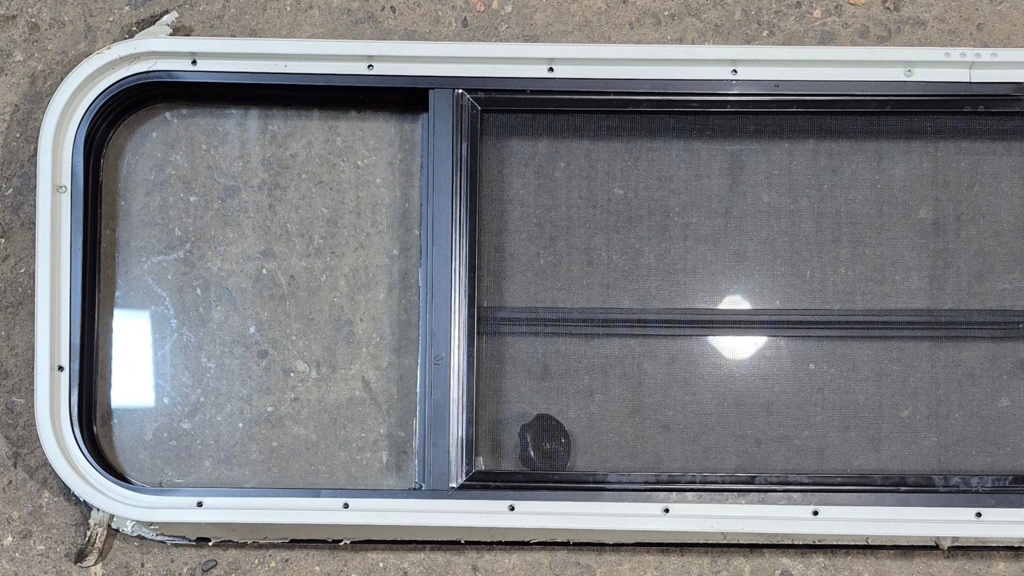 Used Black Radius Opening Window : 59 1/2" W x 14 3/4" H x 1 3/4" - Young Farts RV Parts