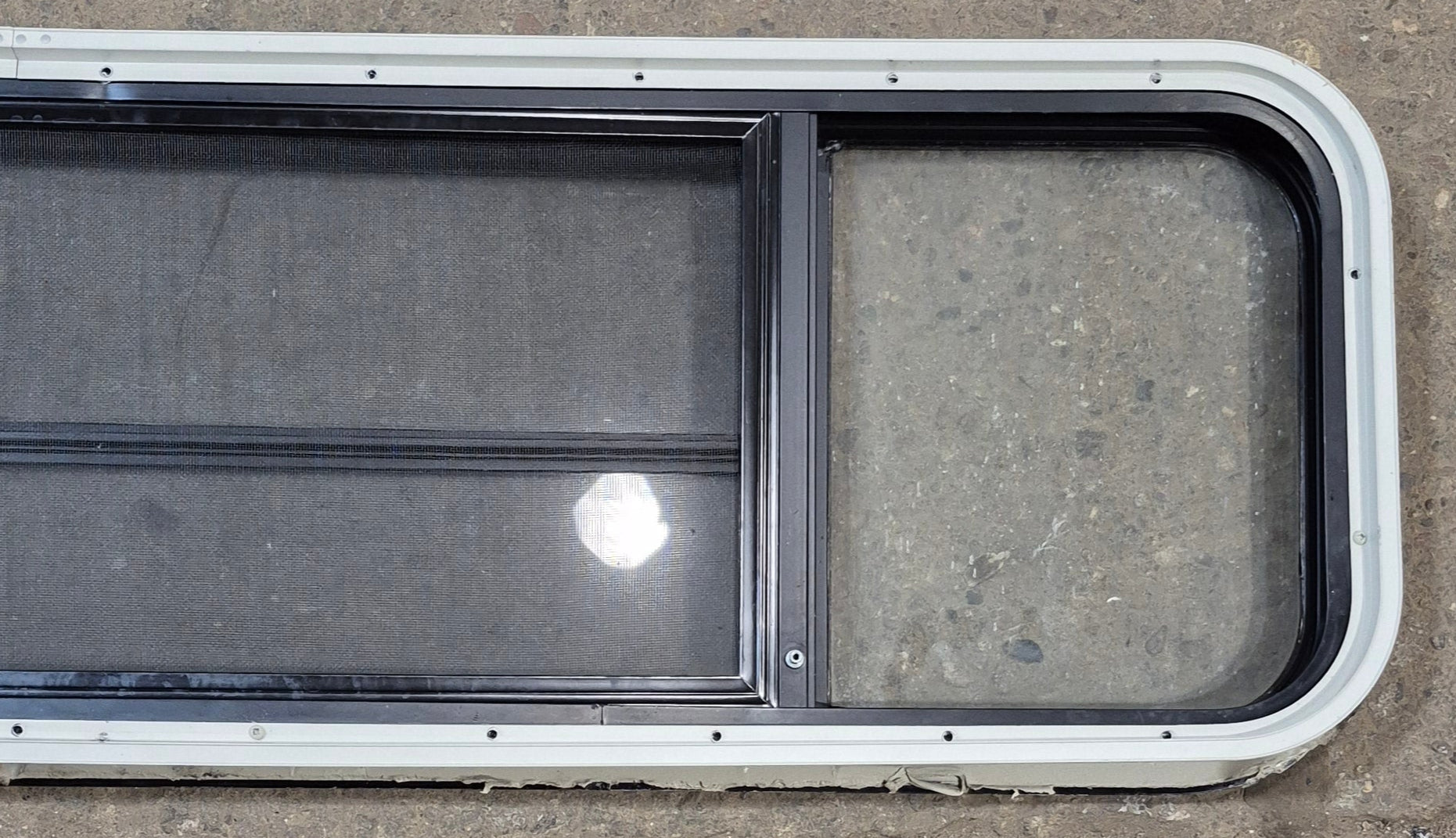 Used Black Radius Opening Window : 59 1/2" W x 14 3/4" H x 1 3/4" - Young Farts RV Parts