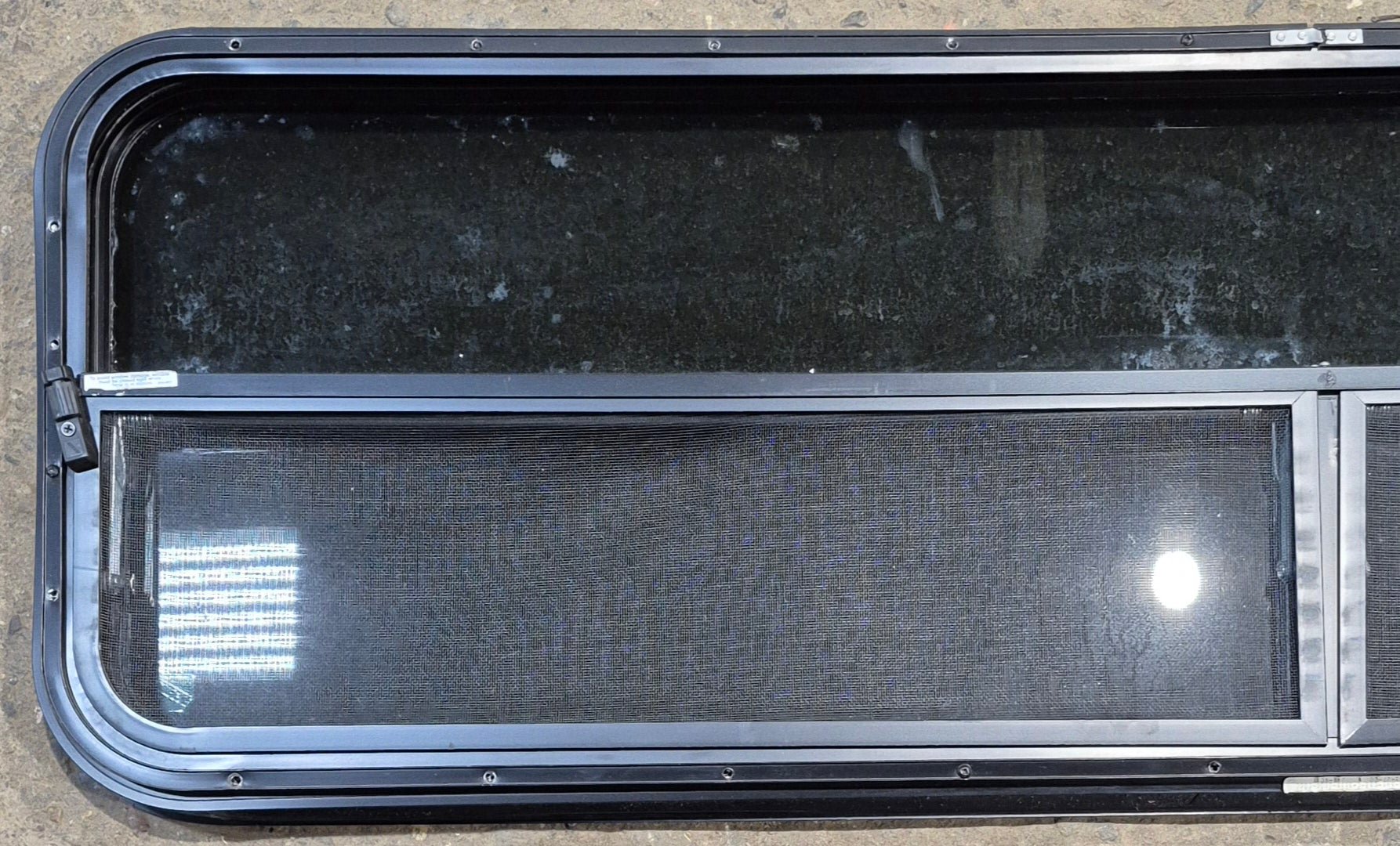 Used Black Radius Opening Window : 59 1/2" W x 17 1/4" H x 1 1/4" - Young Farts RV Parts