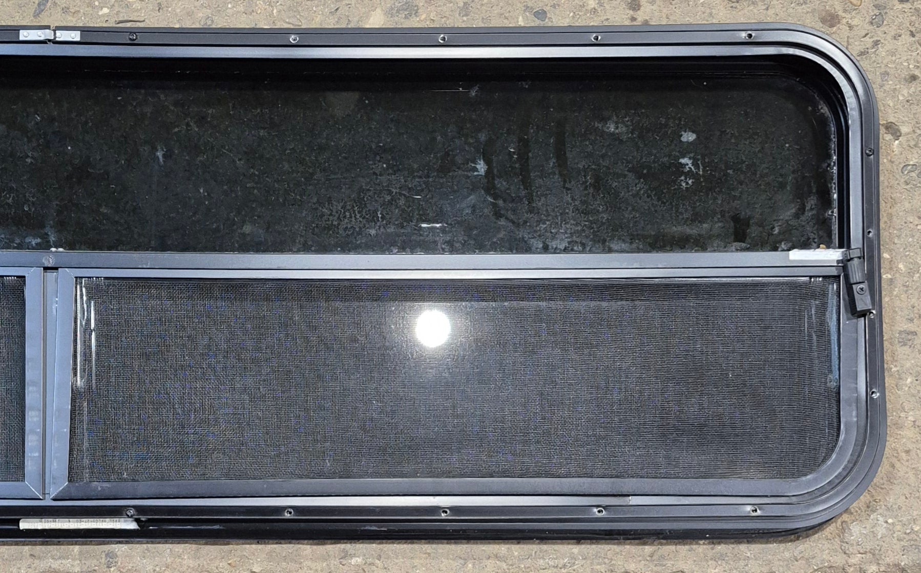 Used Black Radius Opening Window : 59 1/2" W x 17 1/4" H x 1 1/4" - Young Farts RV Parts