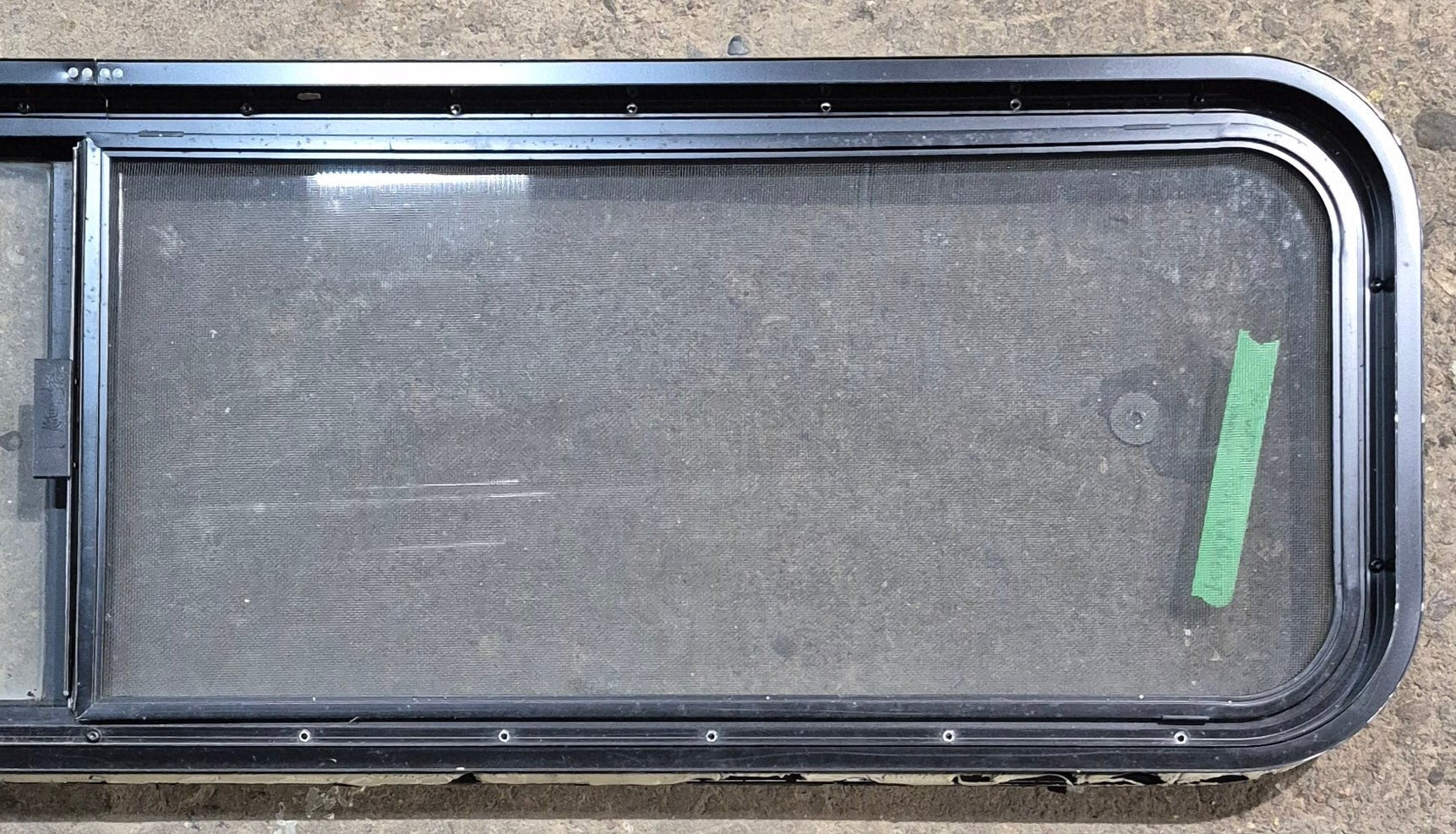 Used Black Radius Opening Window : 59 1/4" W x 14 1/2" H x 1 7/8" - Young Farts RV Parts