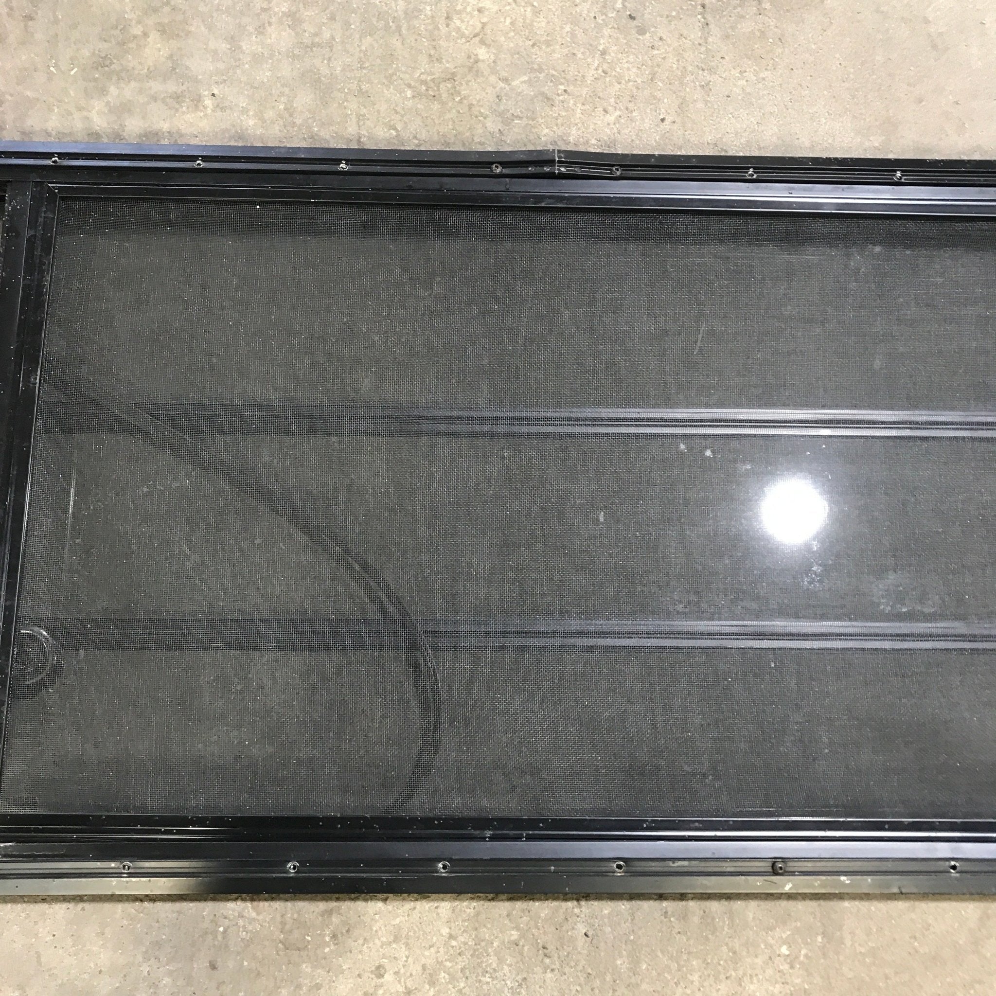 Used Black Radius Opening Window : 59.75" x 21.75" x 2" - Young Farts RV Parts