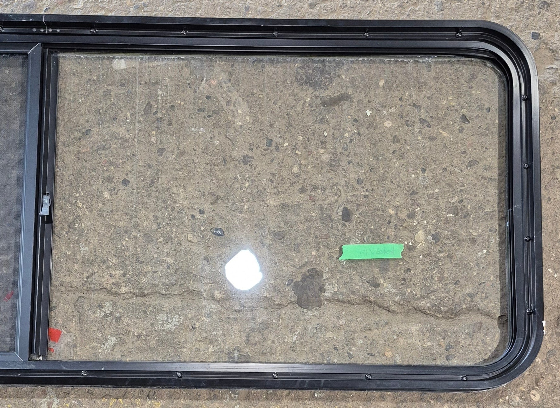 Used Black Radius Opening Window : 60 1/4" W x 21 3/4" H x 1 3/4" - Young Farts RV Parts